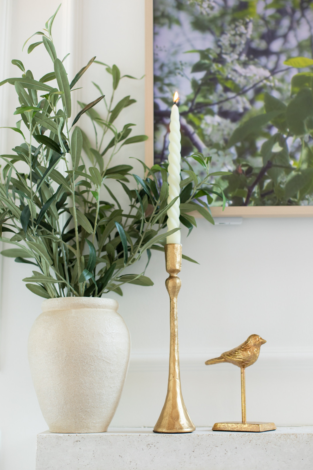 Your mantel just got an upgrade for Spring with gold candle stick holders, spiral candles, and gold birds! All from Amazon  

 