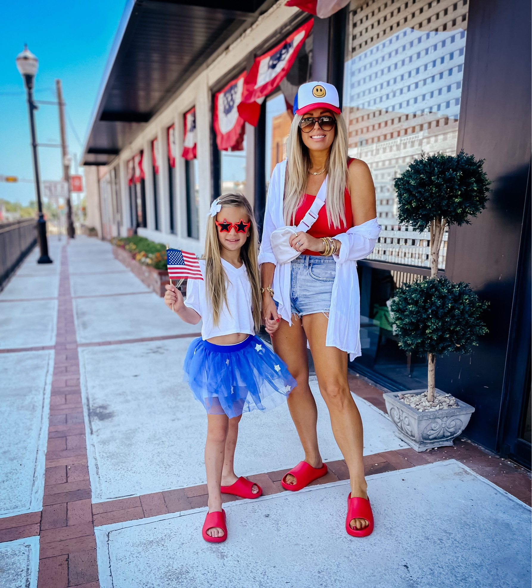 Tank top sized up to a large. White button down fits TTS, wearing 8 to 10. 
July 4th outfit. Tennis fits TTS, but I sized up to a large for a looser fit. Sized up one size to 30 in the denim jeans. 4th of July. Memorial weekend. Red, white and blue. Belt bag. Summer fashion. Trucker hat. Lake outfit 

#LTKunder50 #LTKFind #LTKsalealert