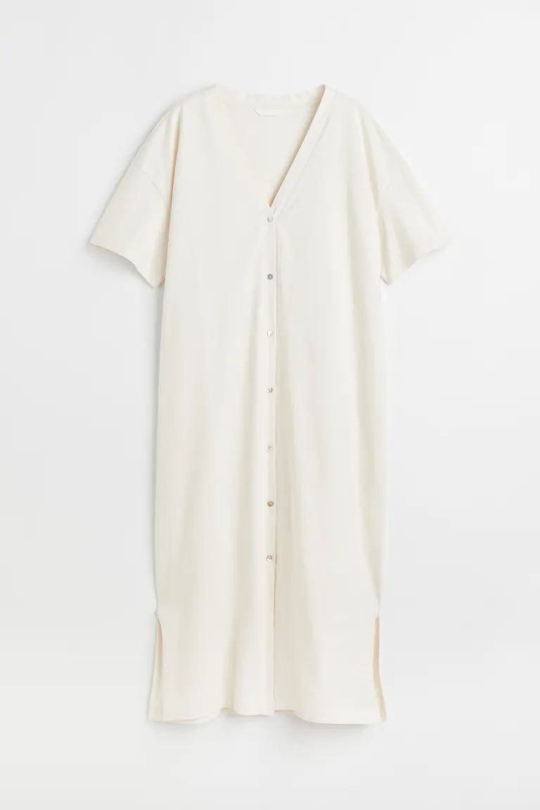 Straight-cut, relaxed-fit, calf-length dress in soft cotton jersey. V-neck, buttons full length o... | H&M (US + CA)