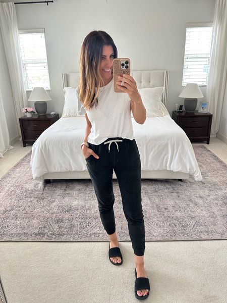 Casual weekend style 🖤 love these joggers so much! Perfect for travel or chasing the kids around. I wear a size small 


#vuori #joggers #weekendstyle #casualoutfit #outfitidea #momstyle #targetstyle #slides 

#LTKStyleTip #LTKFindsUnder100 #LTKOver40