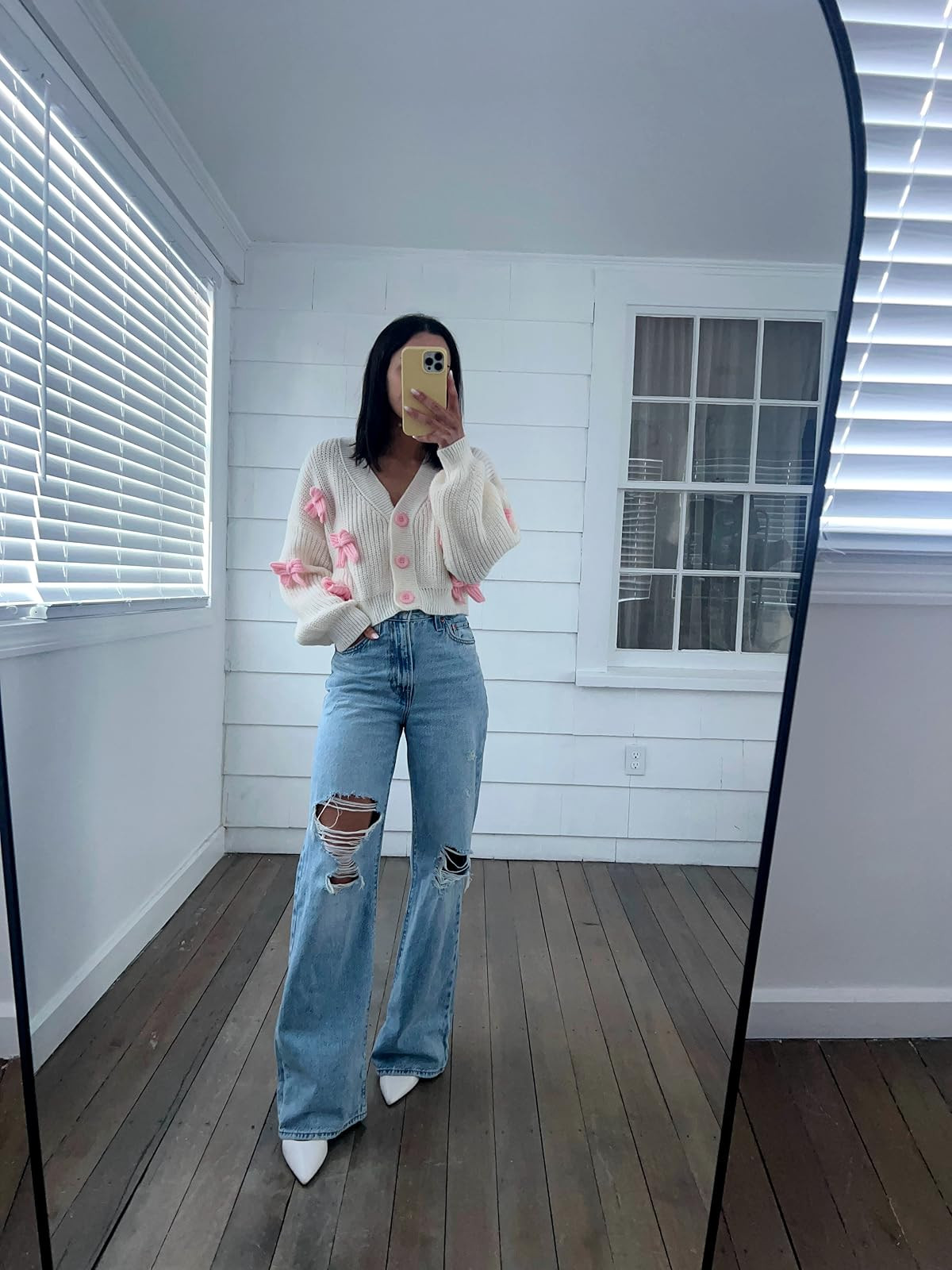 Valentines day outfit- Jeans in 24, sweater in S, heels true to size. Bow cardigan/ripped jeans/white heels. 
 

 #LTKPetite #LTKFindsUnder50