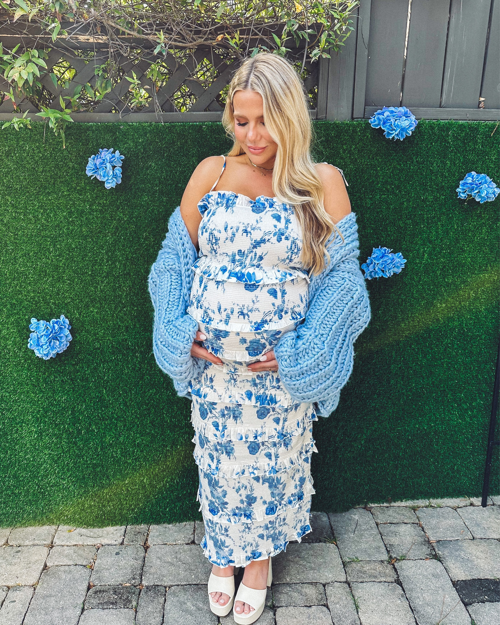 Almost forgot to post my baby shower look here 💙 my amazing friends and fam threw Maitland and I the most special garden party themed spring baby shower and it could not have been more perfect. Wore this blue and white floral smocked, ruched, ruffled dress from V. Chapman to show off the bump. Paired with this sweet blue chunky cardigan and my favorite white platform Larroude heels. 

#LTKshoecrush #LTKSeasonal #LTKbump