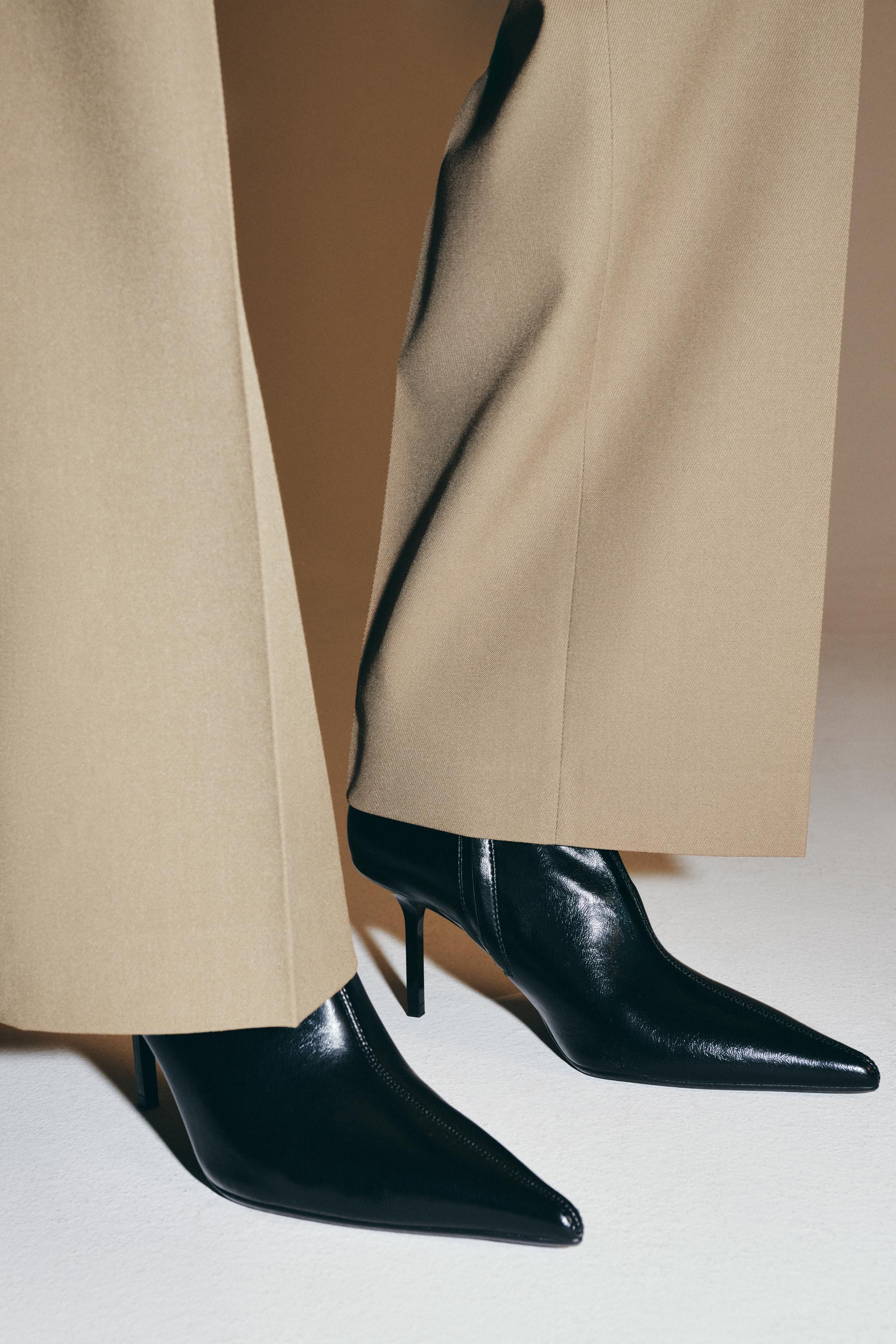 Ankle boot-style shoes. Stretchy fabric upper with a patent finish. Topstitching detail on the bo... | Zara US