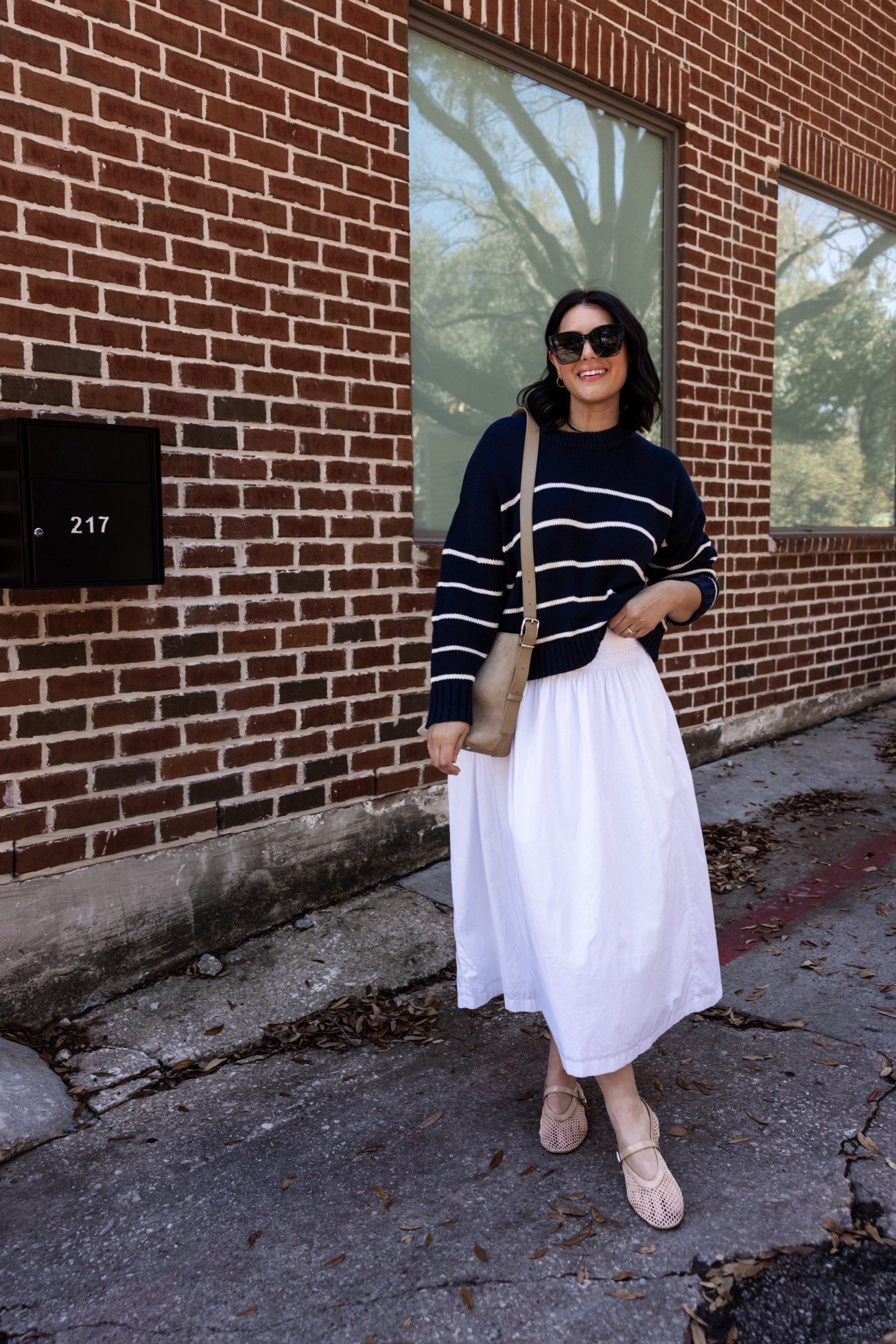 I love bringing back my pieces from last summer for spring, especially this white poplin skirt! I paired with this striped sweater from Quince for an easy transition look. PS: the skirt is on sale this week with the Madewell Insider Event!

I'm in the medium of the skirt, it runs generously bc of the smocked waist. I'm in the large of the sweater because I wanted an oversized fit. Otherwise it's a relaxed fit in your true size.  

 