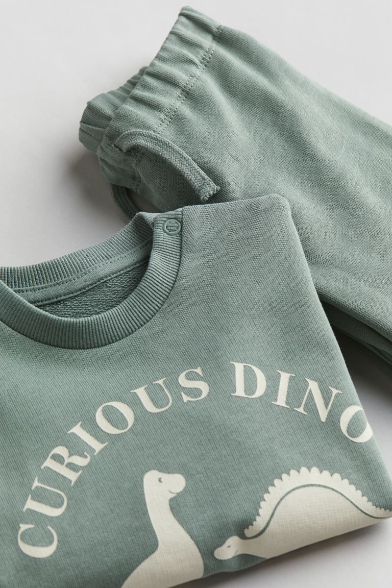 2-piece Sweatsuit - Dusty green/dinosaurs - Kids | H&M US | H&M (US + CA)