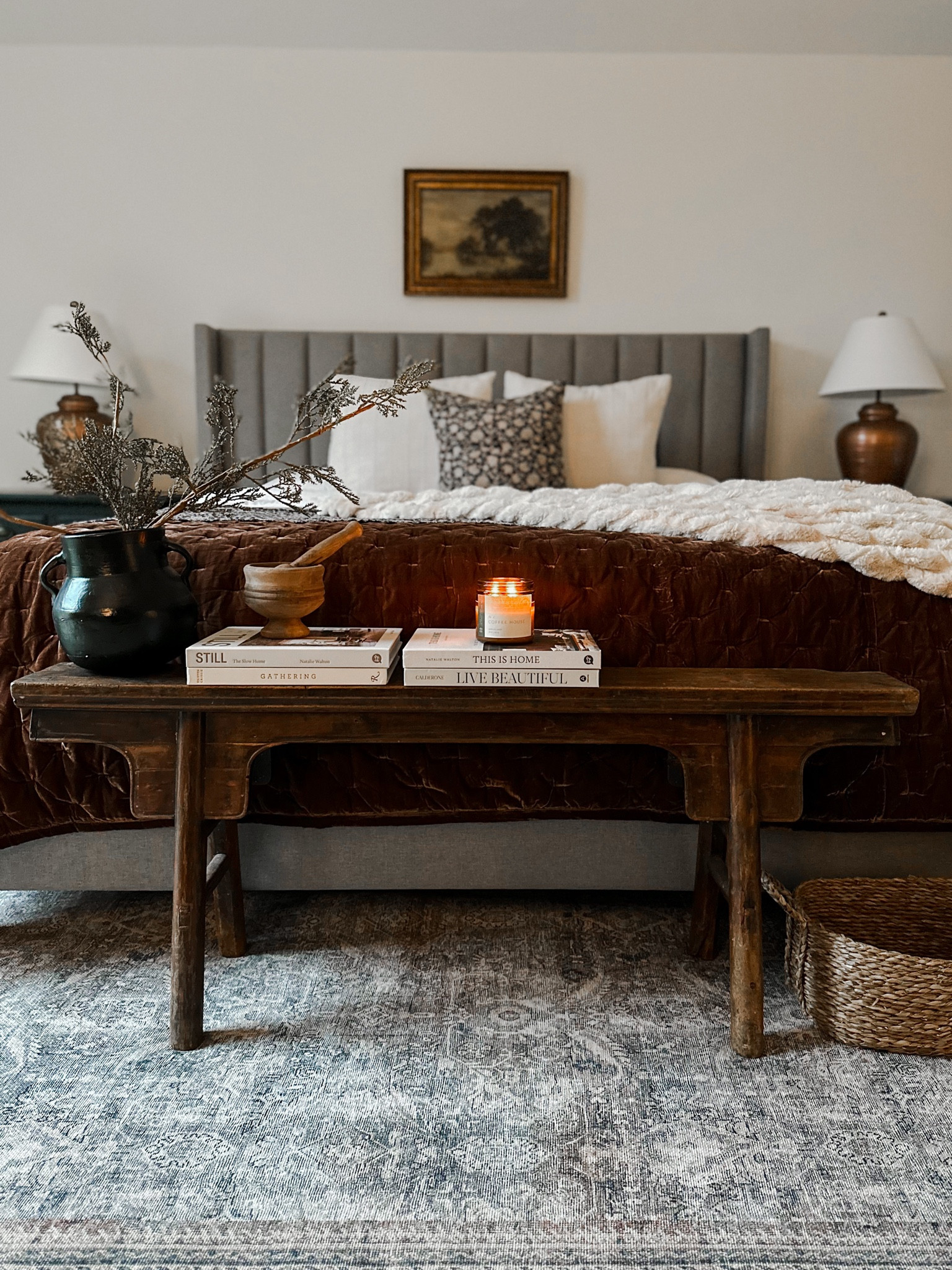 Bedroom, Master Bedroom, Moody Bedroom, Upholstered Bed, Velvet Quilt, Copper Quilt, Rustic Bench, Skinny Bench, Olive Tree, Loloi Rug, Coffee Table Books, Kantha Quilt, Grey Bed, Layered Bed