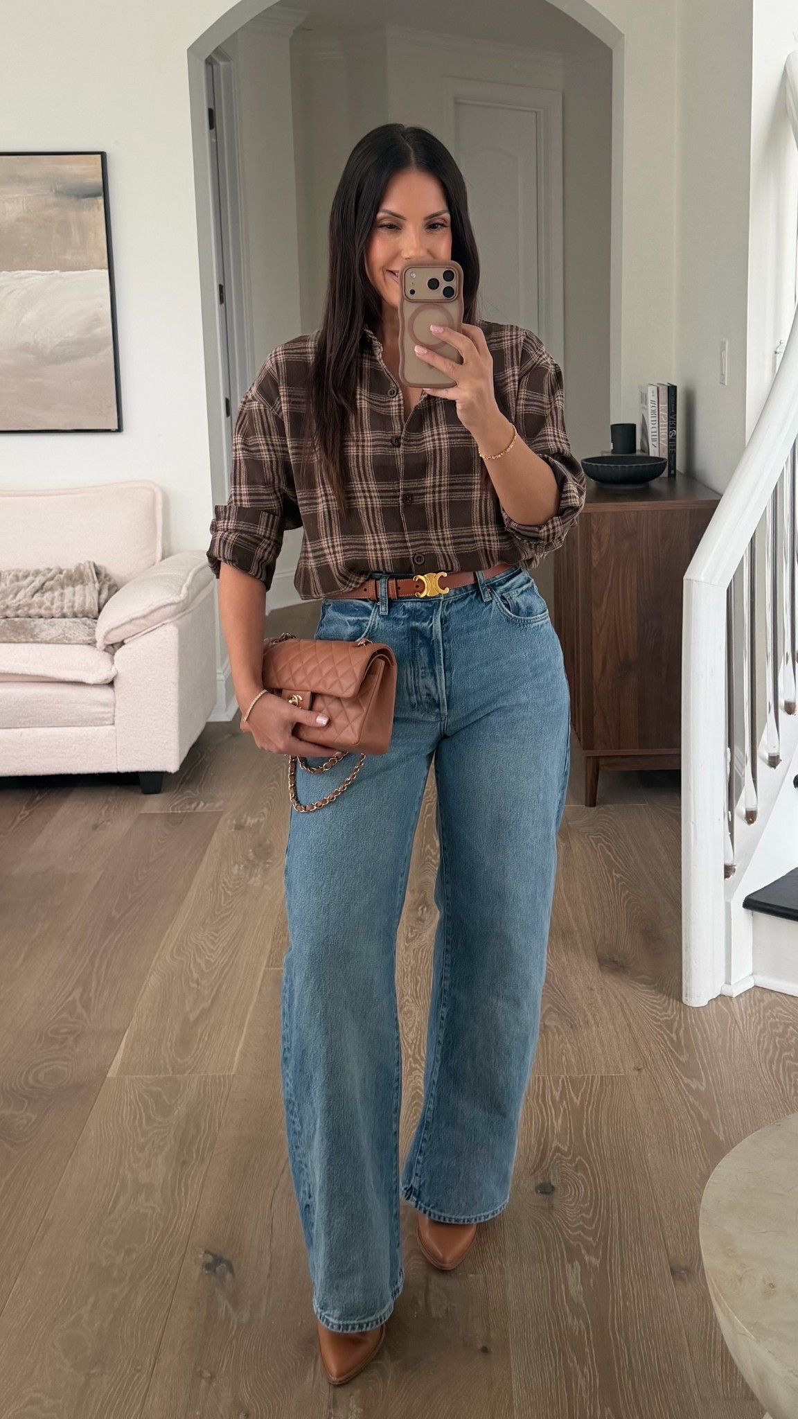 Casual work errands outfit. 
Normally, I do not gravitate towards plaid, but I do love this brown and beige plaid oversized button up from Amazon. 
Plaid top - medium
Jeans - I recommend sizing down - wearing a 25 ￼