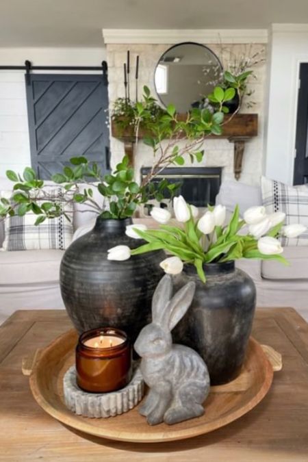 Simple springtime arrangement with faux  stems and tulips, black vases, a bunny and pretty candle all anchored with a beautiful wood tray

#LTKstyletip #LTKSeasonal #LTKhome