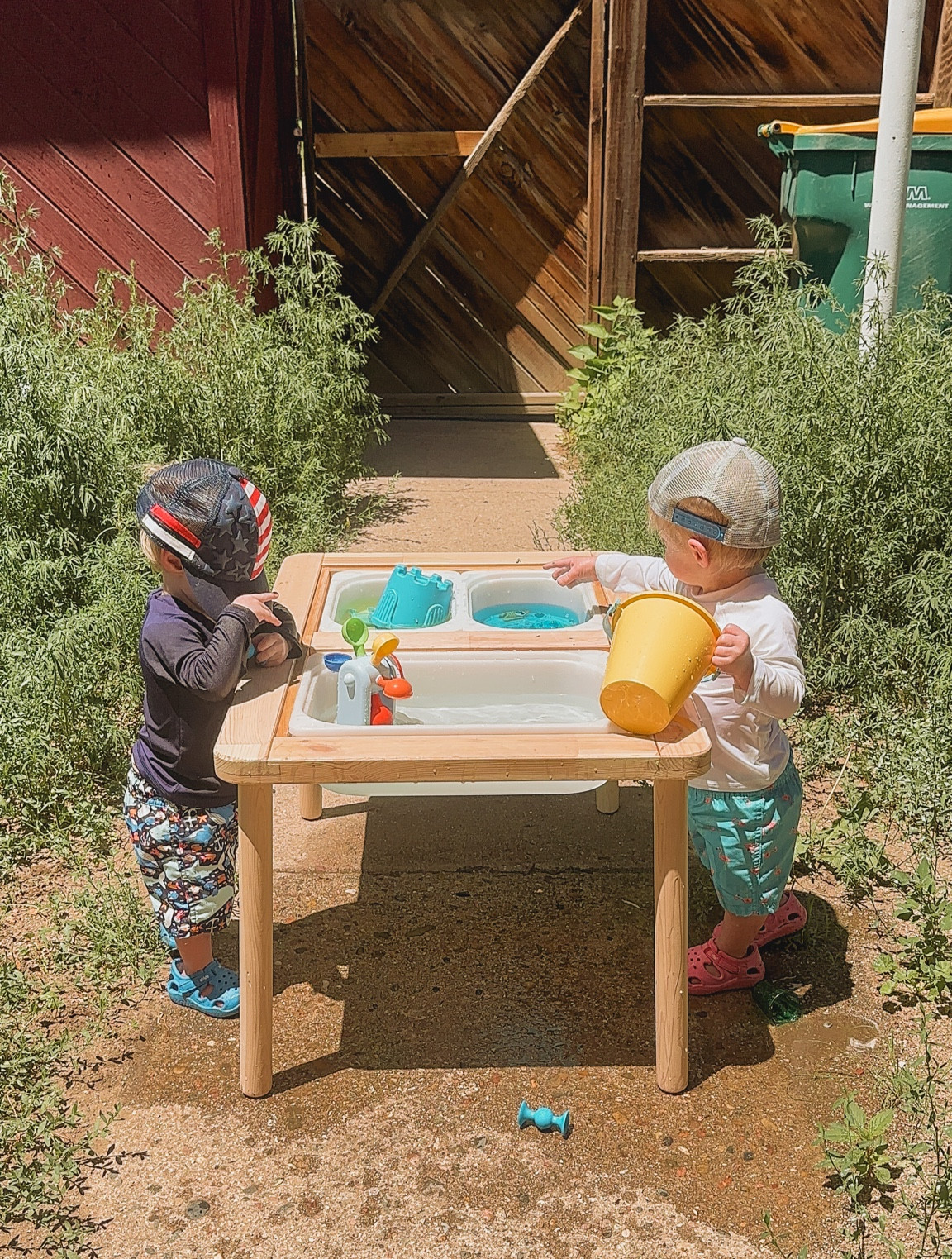 Toddler outdoor water sensory table on a hot summer day

#LTKkids #LTKswim #LTKfamily