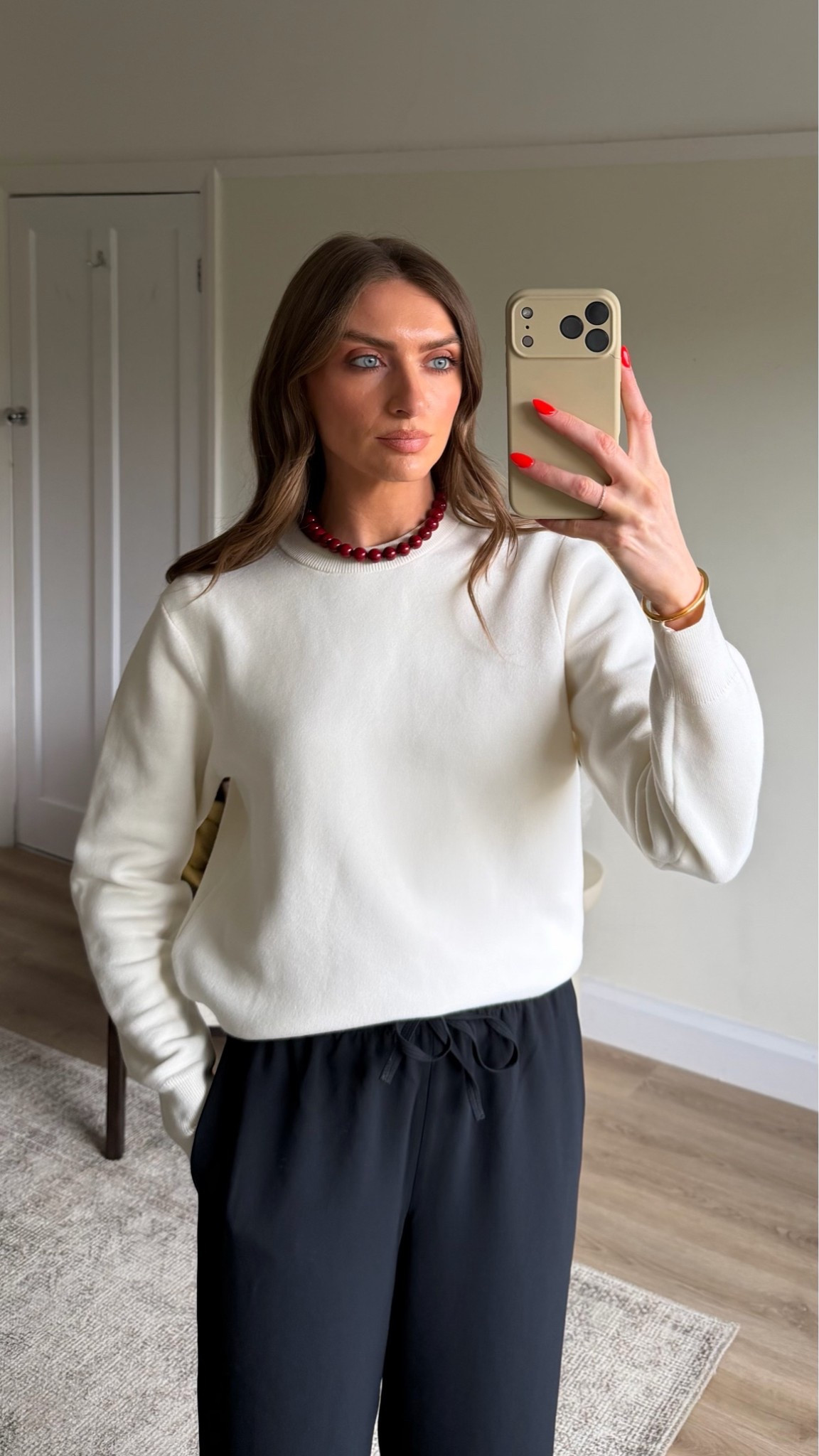 & other stories red beaded necklace 20% off using: EMILY20 (expires 31st May) 
Small in the UNIQLO sweater
Aritzia trousers