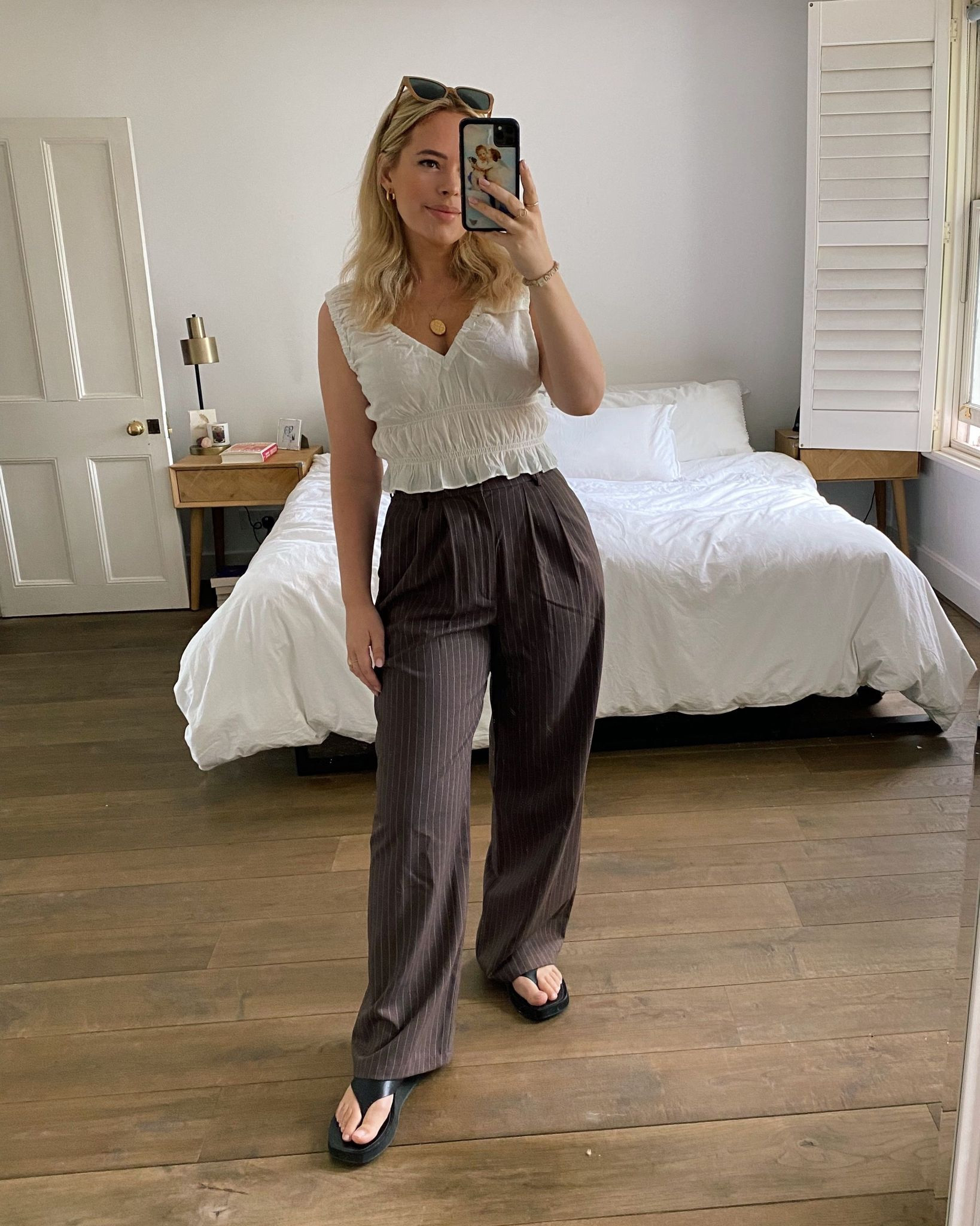 Shirred top, elasticated Shirred top, white top, brown trousers, pinstripe trousers, wide leg trousers, leather flip flop, leather thong sandal, smart casual outfit, summer outfit, Le Specs, Reformation, Ralph Lauren, Free People, Whistles

#LTKSeasonal #LTKstyletip #LTKeurope