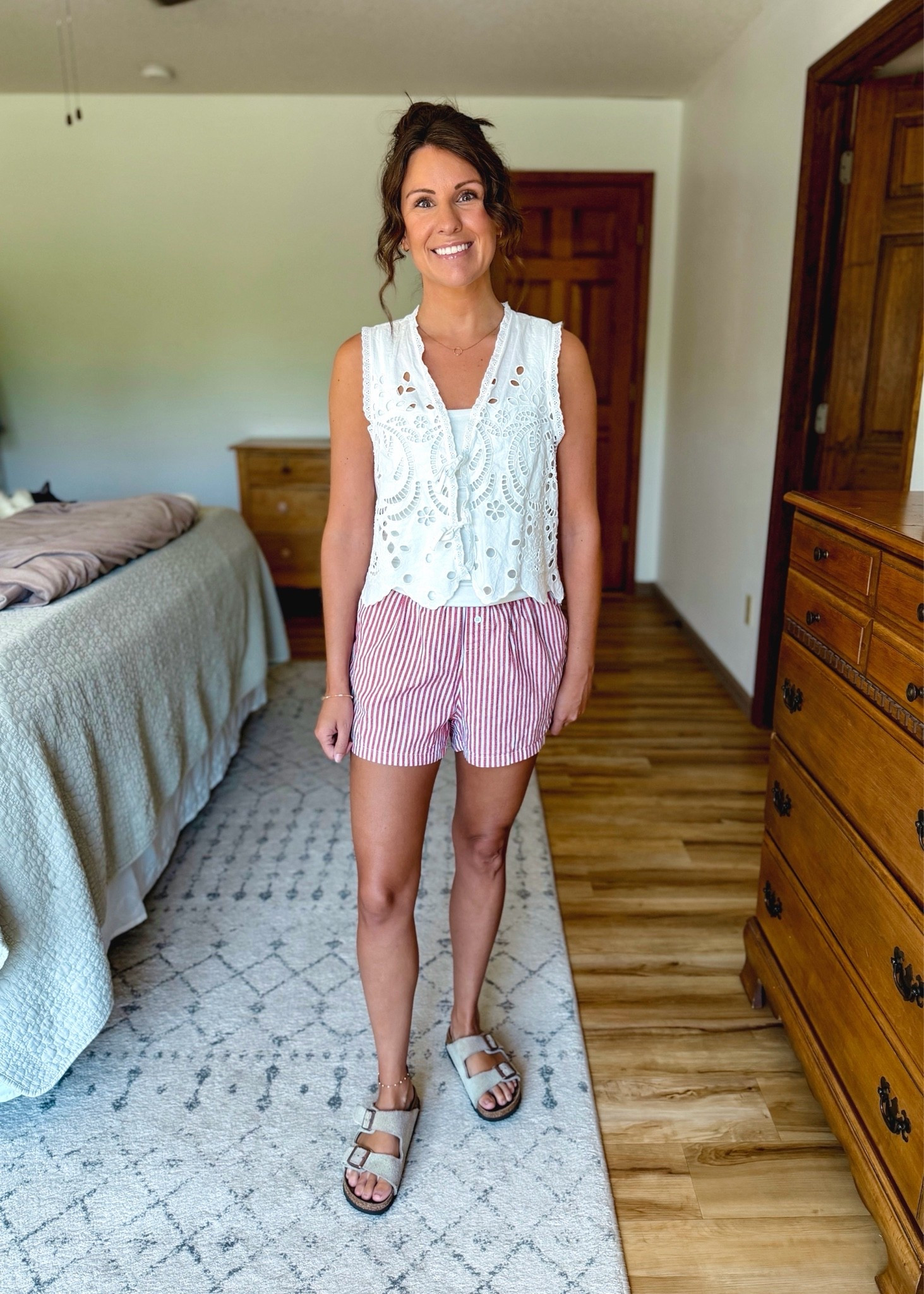 small in my tank, small in my eyelet tank (I also have black and brown), and small in my boxer shorts (8li also own xs and like that fit too). My Birkenstock sandals are size 36.