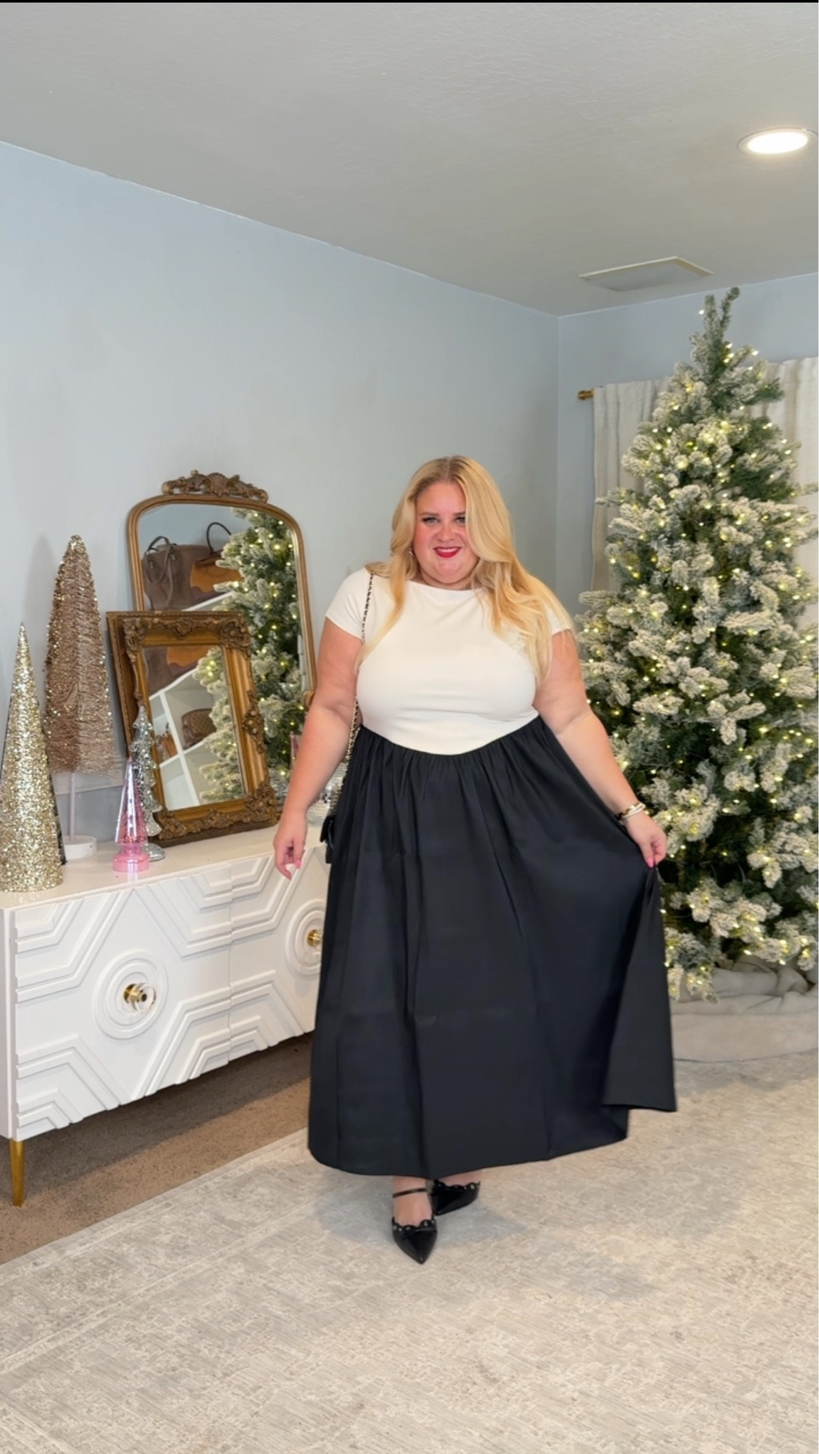 Clean, classic, and unbelievably easy to wear. This black skirt has that perfect volume that moves beautifully without adding bulk, and the white top keeps everything crisp and polished. I’m in a 1X in both pieces and the fit is spot on. This is the kind of outfit you can wear to any holiday event and feel put together without trying.

#LTKFindsUnder50 #LTKPlusSize #LTKHoliday