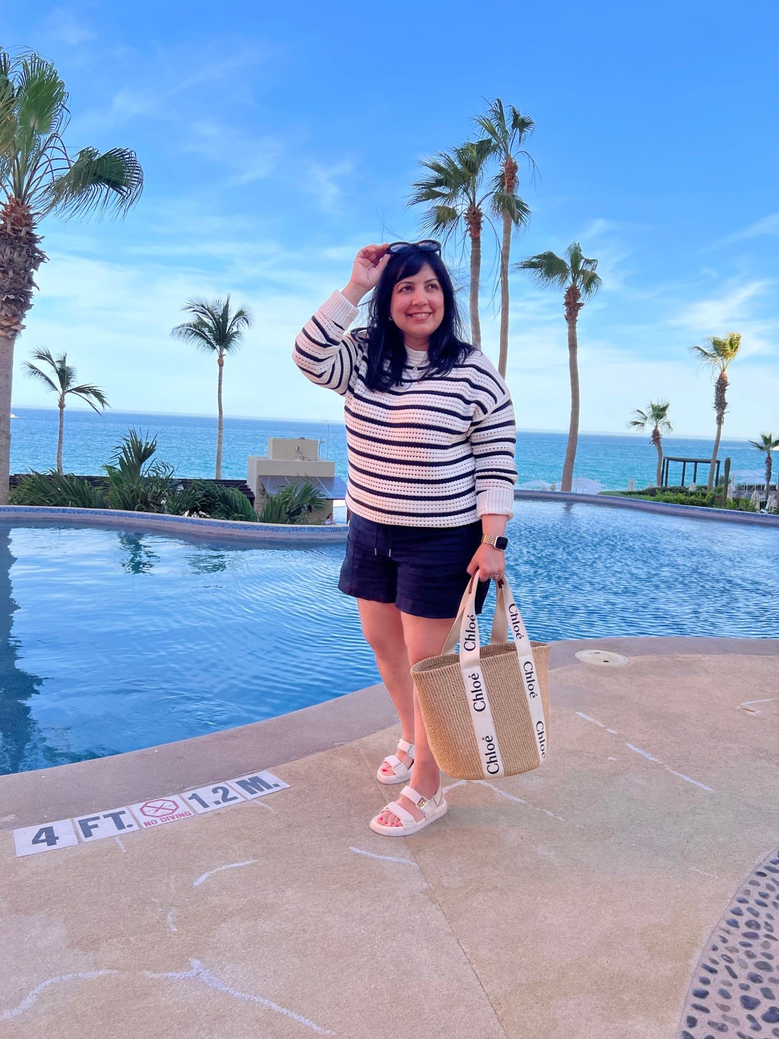 Athleta linen shorts on sale 40% off! 

Spring outfits 2026! Vacation outfit that’s perfect for cool evenings! Athleta linen shorts size large. Lululemon striped cotton crochet sweater size medium. Steve Madden sandals true to size. Chloe straw tote bag. Celine sunglasses.

#LTKSaleAlert #LTKOver40 #LTKMidsize