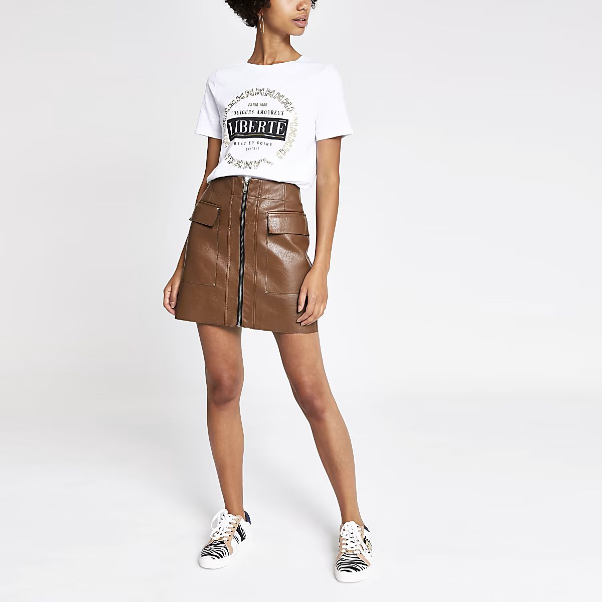 Brown faux leather zip front mini skirt | River Island (US)