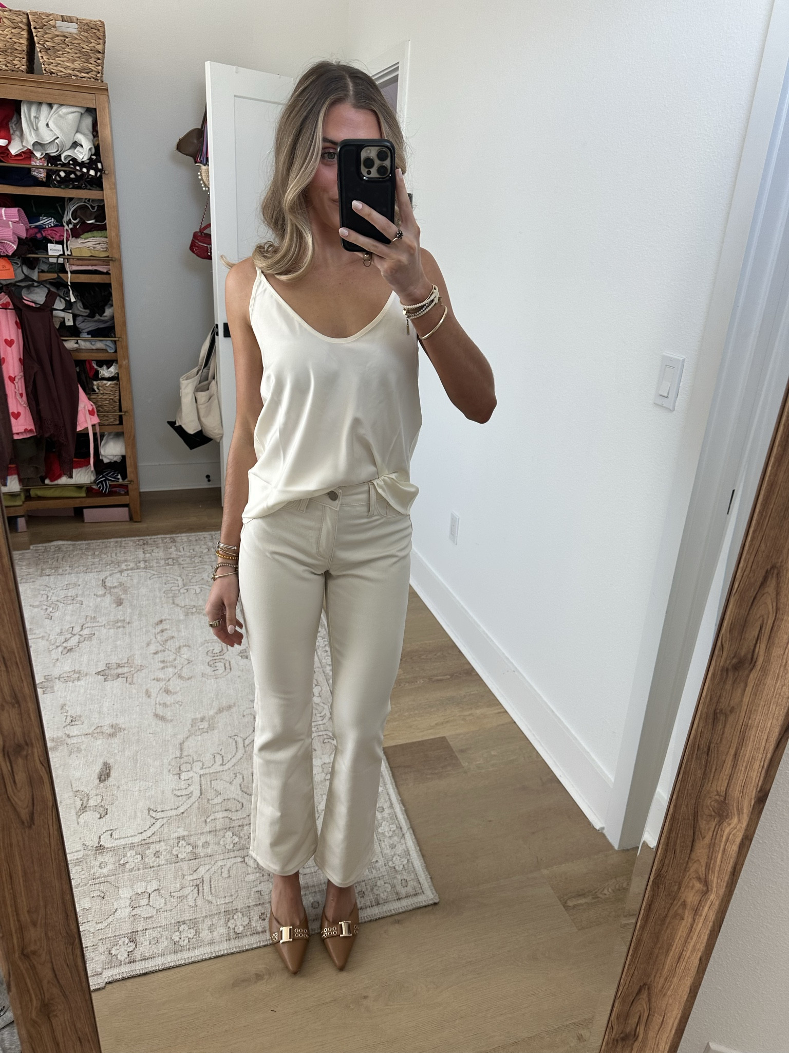 @thenolishop wearing size xs and the size 24 in the jeans. The most stunning pant of the season - meet the Aria Coated Jean. Designed with a sleek, slim bootcut and fitted through the hips and knee and flared at the hem. This denim fabric is comfortable yet structured with a leather-like look. Featuring a high-rise fit and tailored to pair with heels or flats, this piece is perfect from day to night. A refined silky essential with timeless appeal - you'll fall in love with the Yara Camisole. This top features a graceful deep v-neck and adjustable straps for a custom fit that works beautifully layered or worn alone. Its modern silhouette and stunning pearl color make it the perfect foundation piece for warm-weather styling and year-round outfitting.

#LTKValentine #LTKgrwm #LTKootd