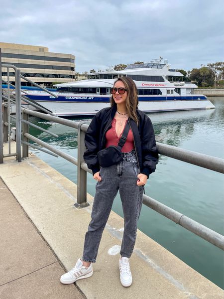 What I wore to Catalina Island ⛴️ It was a chilly day sightseeing. My black bomber jacket is back in stock! It’s SO good and can be worn year round. An investment but price per wear ladies! I’ve worn her countless times. My belt bag looks similar to the Lululemon one but for a fraction of the price. My sneakers are currently on sale! My popular sunglasses are on sale 2 for 1! 

Spring outfit, vacation outfit, bomber jacket, belt bag, fanny bag, sunglasses, jeans, Adidas sneakers, sale, The Stylizt 




#LTKSeasonal #LTKSaleAlert #LTKStyleTip