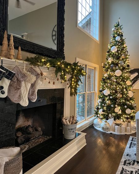 Living room Christmas decor. Christmas decor. Christmas mantle. Christmas tree. Black and white Christmas decor. Christmas stockings. Mantle decor. Christmas decorations. Holiday home decor. 

#LTKhome #LTKHoliday