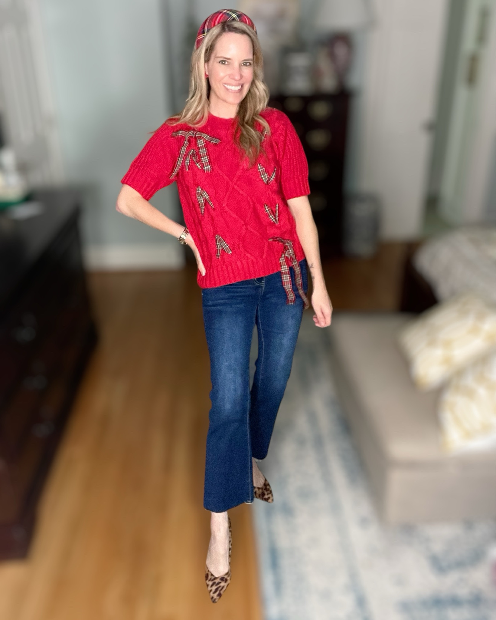 🍂🎀 Thanksgiving Outfit Idea
Festive without being over the top — I’m obsessed with this red cable knit sweater with the little tartan bows 🎁 It’s giving holiday cheer but still totally wearable for Thanksgiving dinner, school celebrations, or holiday photos. The short sleeves make it perfect for those of us who run warm while hosting 🙋‍♀️

Paired it with my go-to cropped flare jeans (so flattering with heels!) and leopard pumps for a fun, classic pattern mix. Finished with my tartan padded headband + holiday flower studs to tie it all together. 🍒

Wearing size Small in the sweater / jeans fit TTS.

⸻

SHOP THE LOOK👇
❤️ Plaid Bow Sweater (Amazon)
👖 Cropped Flare Jeans (Amazon)
🐆 Leopard Heels (Sam Edelman / Macy’s option)
🎀 Tartan Headband
🌺 Flower Stud Earrings (under $10!)

⸻


thanksgiving outfit ideas • casual holiday outfit • cozy fall outfit • christmas sweater outfit • plaid bow sweater • cute thanksgiving clothes • what to wear for thanksgiving dinner • jeans and heels outfit • holiday headband look • affordable holiday style • seasonal outfit ideas 🍁✨


#LTKFindsUnder50 #LTKFindsUnder100 #LTKHoliday