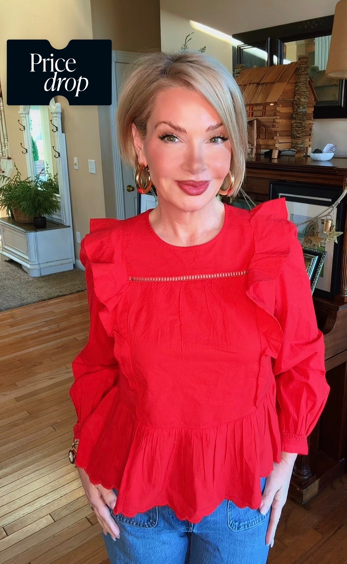 A vibrant red, lightweight woven blouse with soft ruffle detailing along the shoulders for subtle structure and movement. Features a relaxed, flowy silhouette with a gentle peplum hem that skims the body without clinging. Long sleeves with elastic cuffs add an easy, wearable finish. The high neckline includes a delicate ladder-lace detail for texture and interest.

Easy to dress up or down, this top pairs effortlessly with denim for everyday wear or trousers and heels for a more elevated look. Flattering, comfortable, and eye-catching without being overdone.

#LTKSeasonal #LTKValentine #LTKgrwm