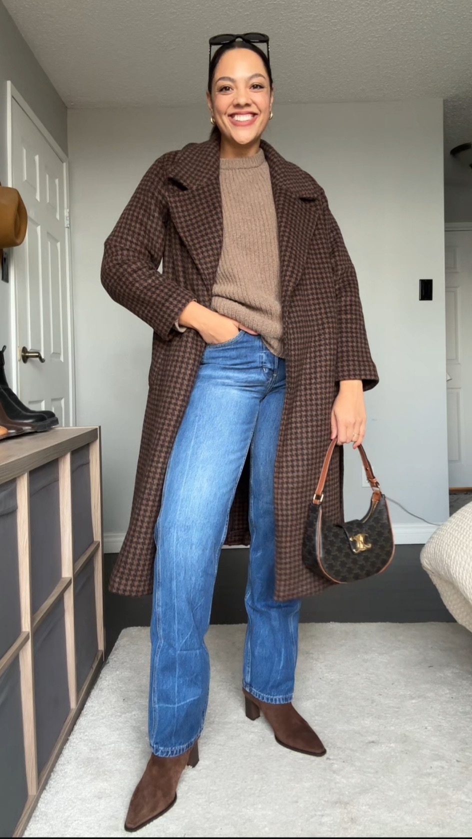 Ways to wear a crewneck sweater! Details below:

-Poppy Barley crewneck sweater in the colour dune. Made with 100% superfine lambswool. Super soft and versatile! I’m wearing a large. 
-COS gold mini hoops. 
-Banana Republic straight medium was jeans. I’m wearing a size 29 long. 
-Abercrombie brown check toe belt coat. I have a medium. 
-Celine Triomphe Ava bag in canvas.
—Brown suede ankle boots  
-Celine Triomphe 52mm sunglasses in black acetate. 

#LTKstyletip #LTKSeasonal #LTKfindsunder100