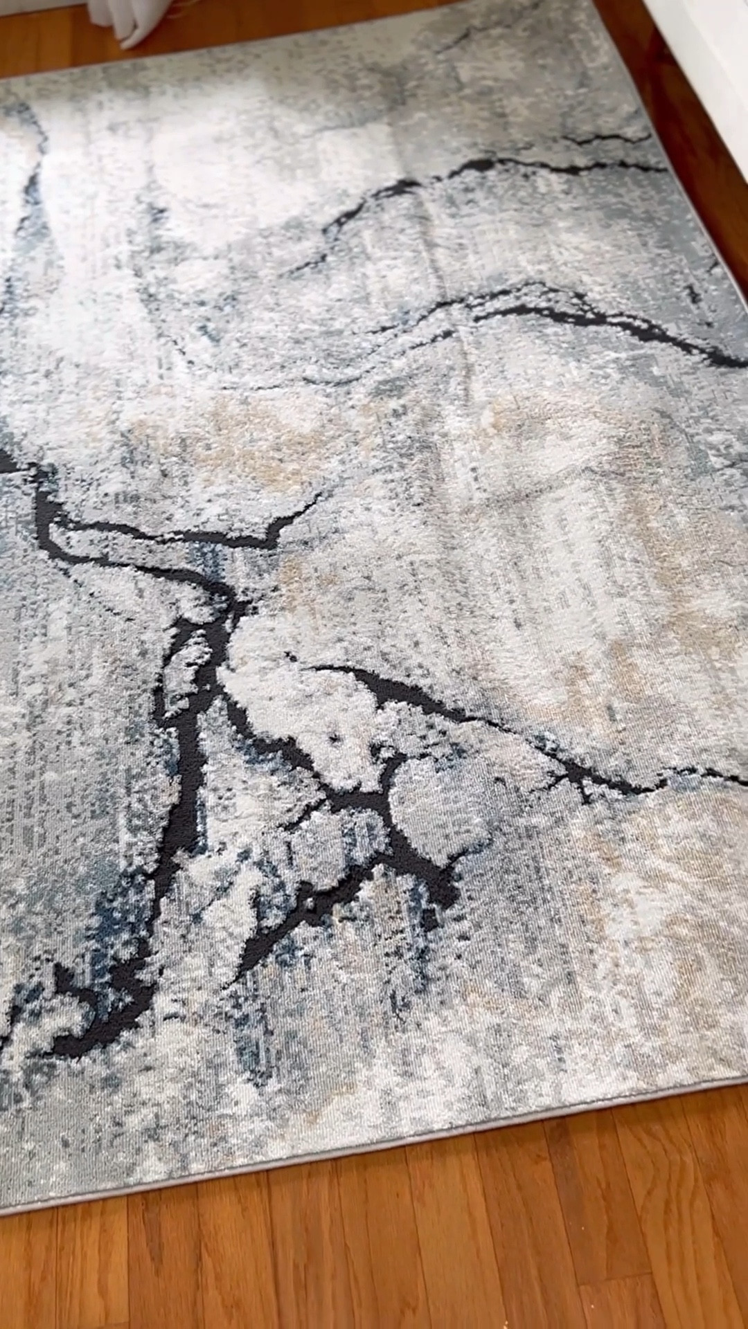 Save 77% off my abstract living room rug! Living room inspo on a budget! White sofa | white coffee table | gold arch mirror | gold home accents | neutral throw pillows | throw blanket | abstract rug 
@wayfair #wayfairhomefinds 



#LTKSaleAlert #LTKHome