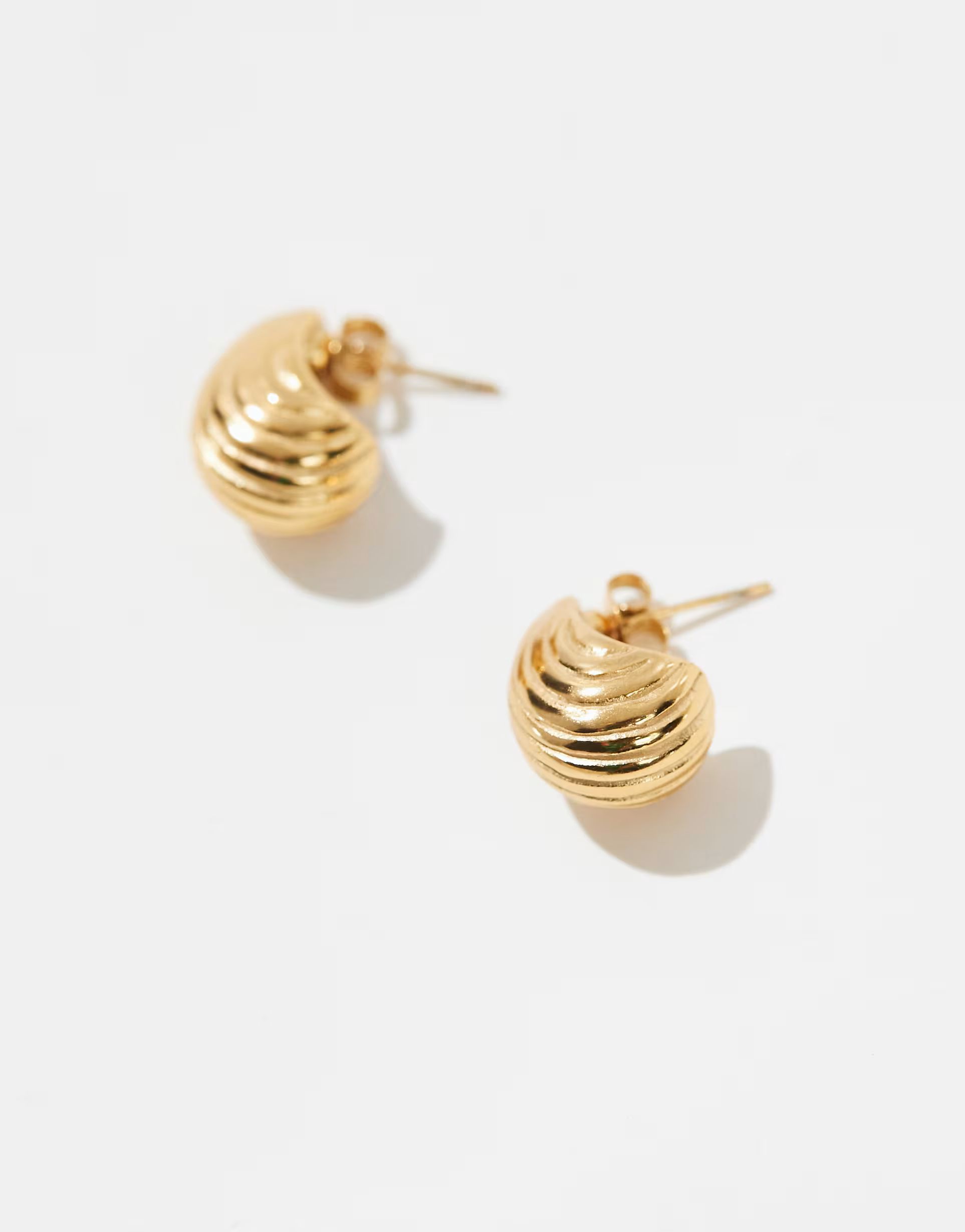 ASOS DESIGN waterproof stainless steel stud earrings with ridged molten detail in gold tone | ASOS (Global)