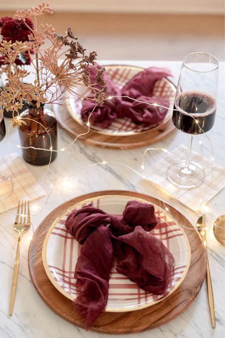 It only looks fancy…I promise! Layer your plates and top with a cloth napkin tied up in a bow for a holiday feel to your Christmas table setting   

#LTKunder50 #LTKHoliday #LTKstyletip