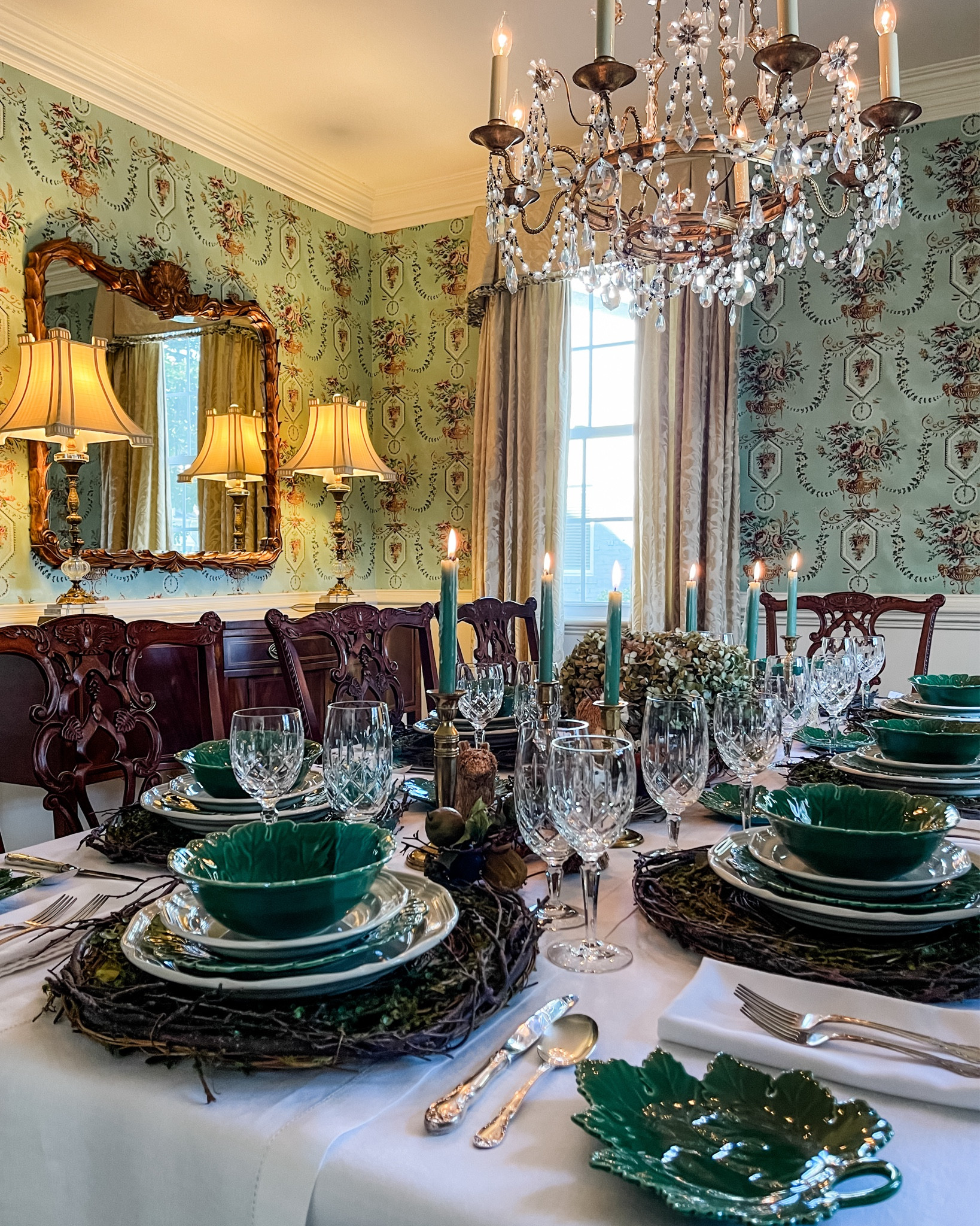 Did you know your dining table can become a masterpiece that elevates every gathering? 🍁 For me, it’s not just about serving a meal—it’s about setting the stage for magical, unforgettable moments. ✨🍂

Today, I’m sharing a woodland-inspired tablescape from last fall that brings nature’s charm indoors! 🍂 The warm tones of brown, green, gold, and burgundy create a cozy, inviting feel, perfect for any autumn gathering. My low-profile centerpiece features twig swags, a wicker cornucopia filled with dried hydrangeas, and accents like velvet pumpkins, faux fruit, and whimsical woodland critters—because the details make all the difference! 🐿️🍁🦉🍂

Each place setting is a mix of green and white dinnerware atop rustic grapevine chargers, adding layers of texture and charm. It feels like dining right in the heart of the forest! 🦊  

What do you think—would you recreate this look for your fall gatherings? 🍂🌾 Save this post for future inspo! 🍂🐿️

#FallTablescape #WoodlandDecor #AutumnDiningInspo #CozyHomeVibes #NatureInspiredDecor #VintageDinnerware #TableSettingIdeas #HarvestDecor #SeasonalTableDecor #NeutralFallDecor 

#LTKStyleTip #LTKHome #LTKSeasonal