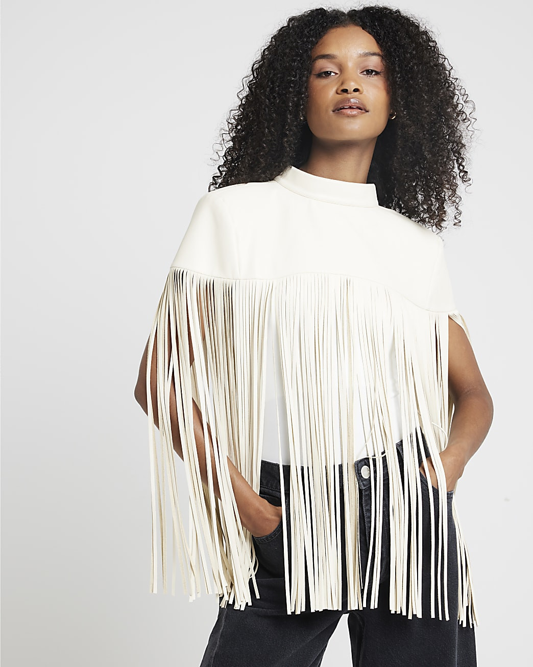 Cream faux leather tassel hem cape | River Island (UK & IE)