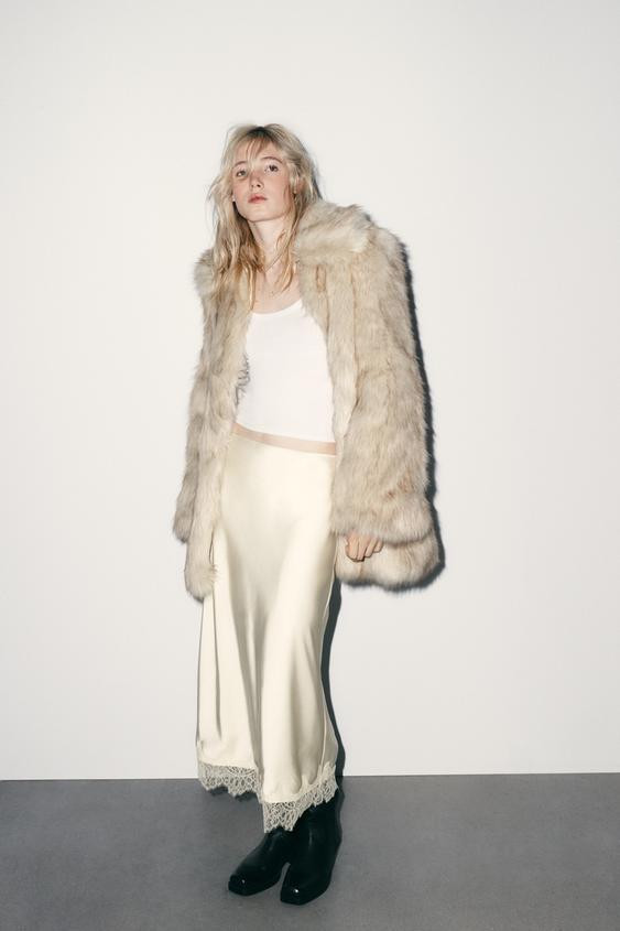 Midi skirt made from satin fabric. High-waist with an elastic waistband. Hem finished with a matc... | Zara UK