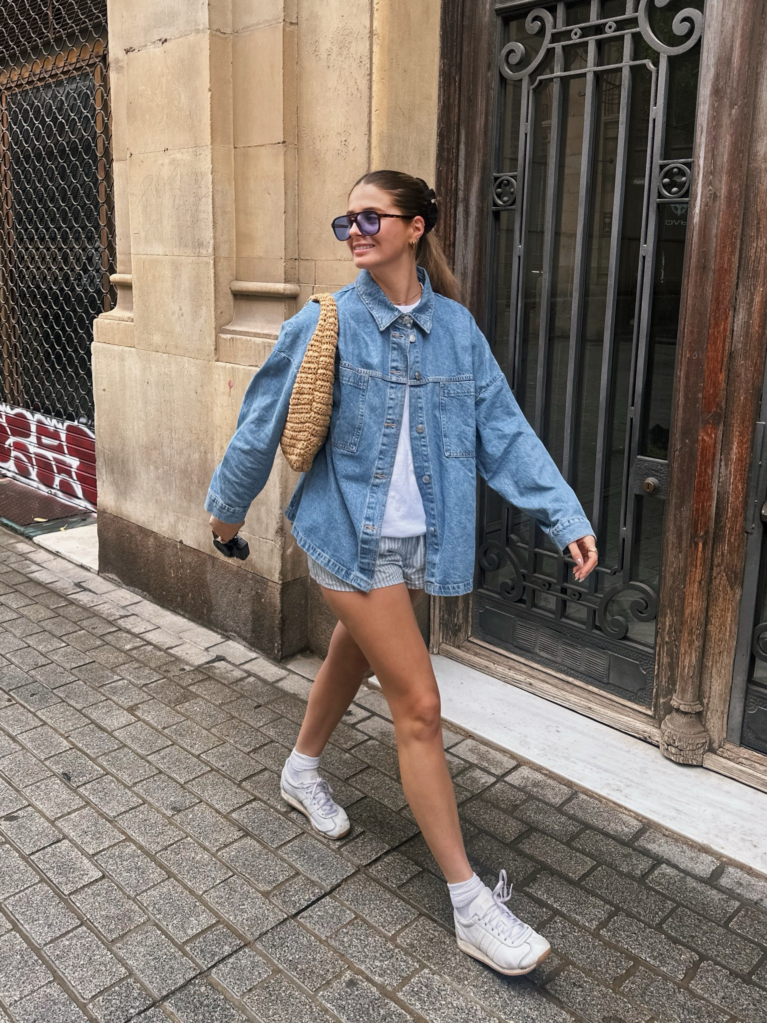 Denim oversized shirt jacket, striped boxer short weekday, white tshirt Uniqlo, blue lense & other stories sunglasses, shoulder raffia bag, white socks, white cream adidas country OG’s black scrunchie, gold jewellery, capsule wardrobe mango Abercrombie 

#LTKsummer #LTKeurope #LTKstyletip