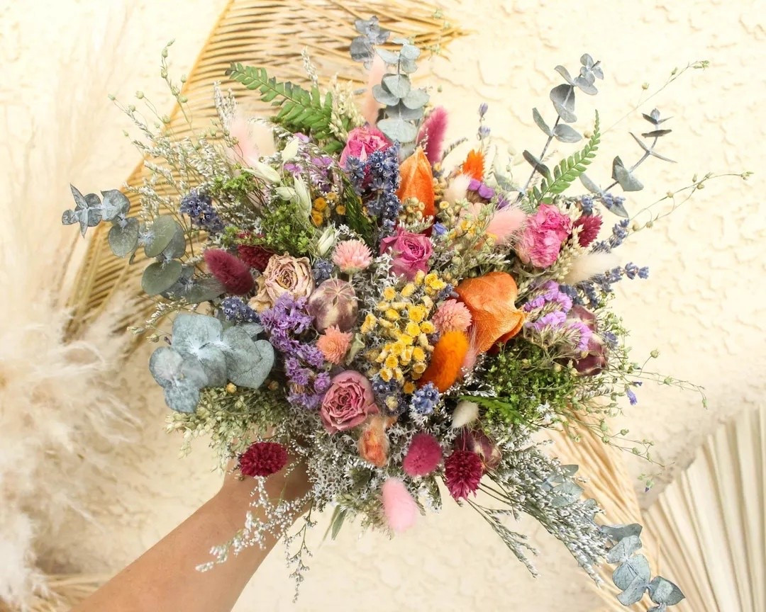 This dreamy dried flower bouquet is filled with fragrant roses, soft bunny tails, globe amaranth, daisies, and delicate wild grasses in the prettiest blush, ivory, and silver tones. Perfect for brides, bridesmaids, or anyone who loves timeless floral decor, this everlasting bouquet brings natural beauty that lasts for years. Available in multiple sizes and your choice of twine, burlap lace, or ivory ribbon for a personalized touch. #DriedFlowerBouquet #BridalBouquet #WeddingFlowers #EverlastingFlowers #BohoWedding #PreservedFlowers #RusticWedding #NeutralDecor #LTKWedding #FloralInspiration

#LTKSeasonal