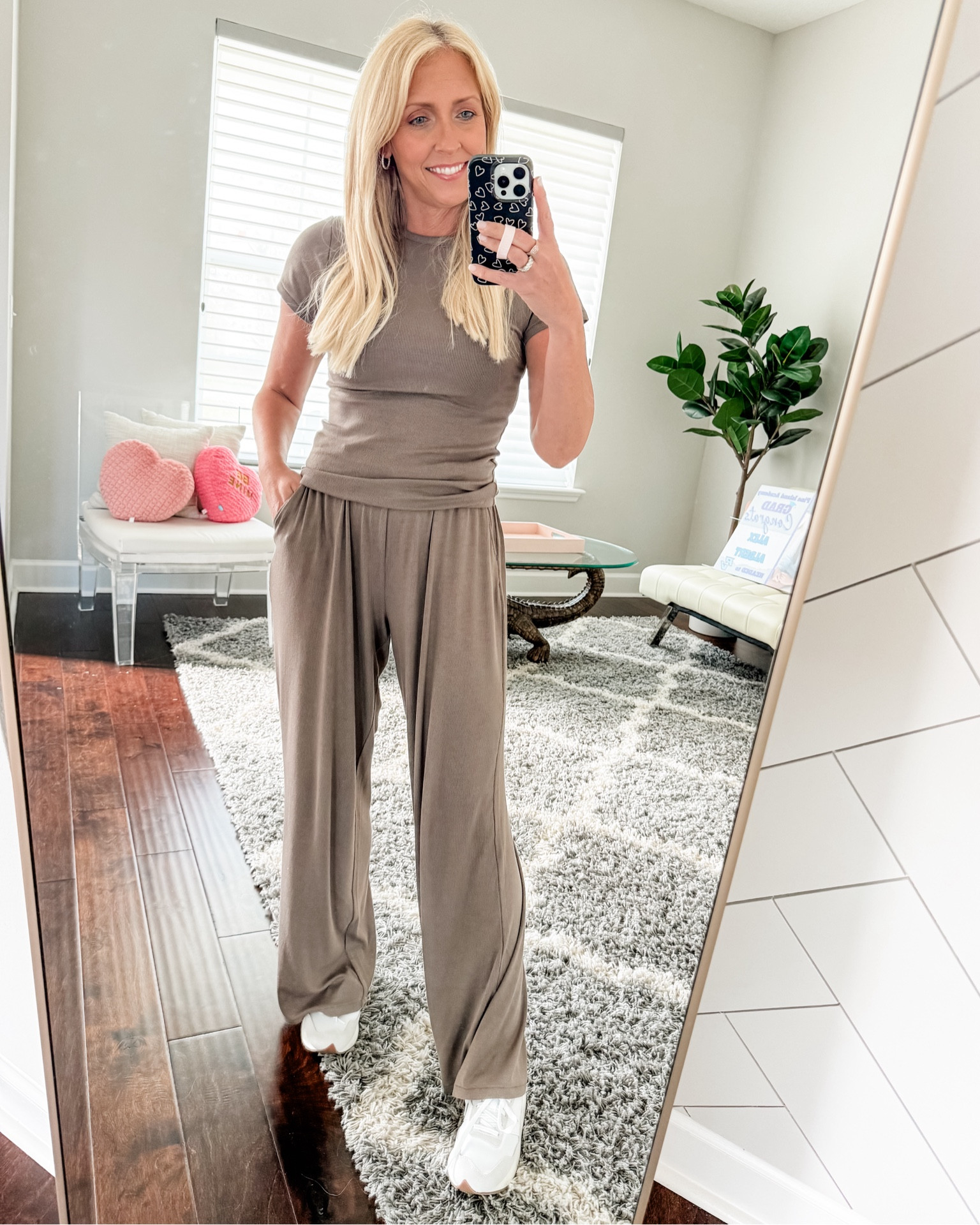 The cuuuuuuuutest lounge set.  Definitely a splurge, but worth it.  Can be worn together or separately.  It’s the slinky rib material from @nuuds and it’s so good.  I ordered my normal size (small) in the pants - probably could have sized down - had to roll them once for length purposes.  I like to size up in the slinky rib shirts so I ordered a medium.  Love love love the way this outfit fits and feels! Great for running erands, working from home or as a travel look.

#LTKtravel #LTKfindsunder100 #LTKover40