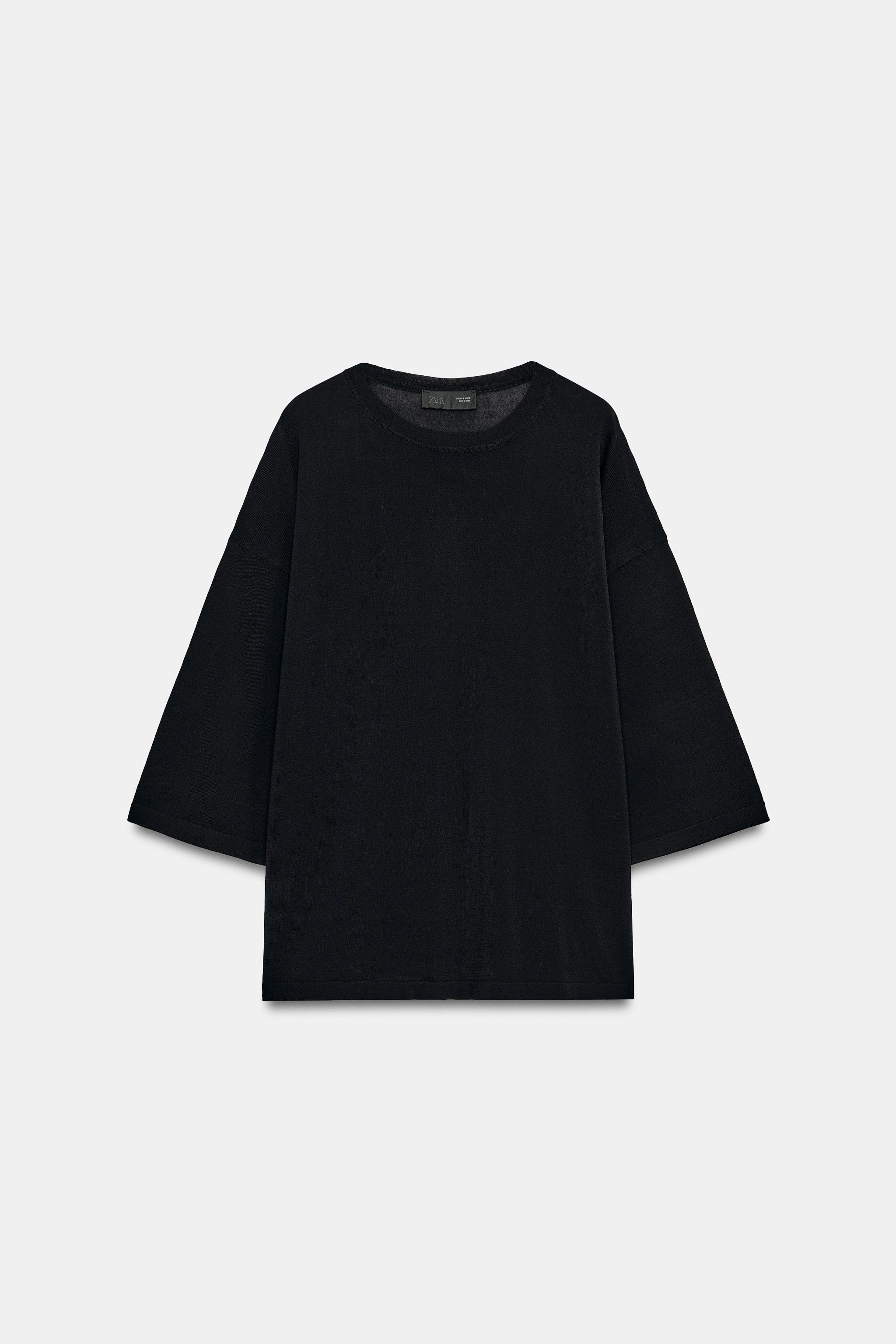 Fine knit top featuring a round neck and elbow-length sleeves. Hem with side vents. | Zara US