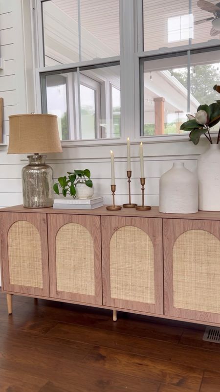 Cane sideboard entry table sofa console table home decor and accessories mercury glass lamp gold candlesticks holders white vases magnolia stems coffee table books small planter frames gallery wall picture frame living room dining room entry decor 

#LTKVideo #LTKStyleTip #LTKHome