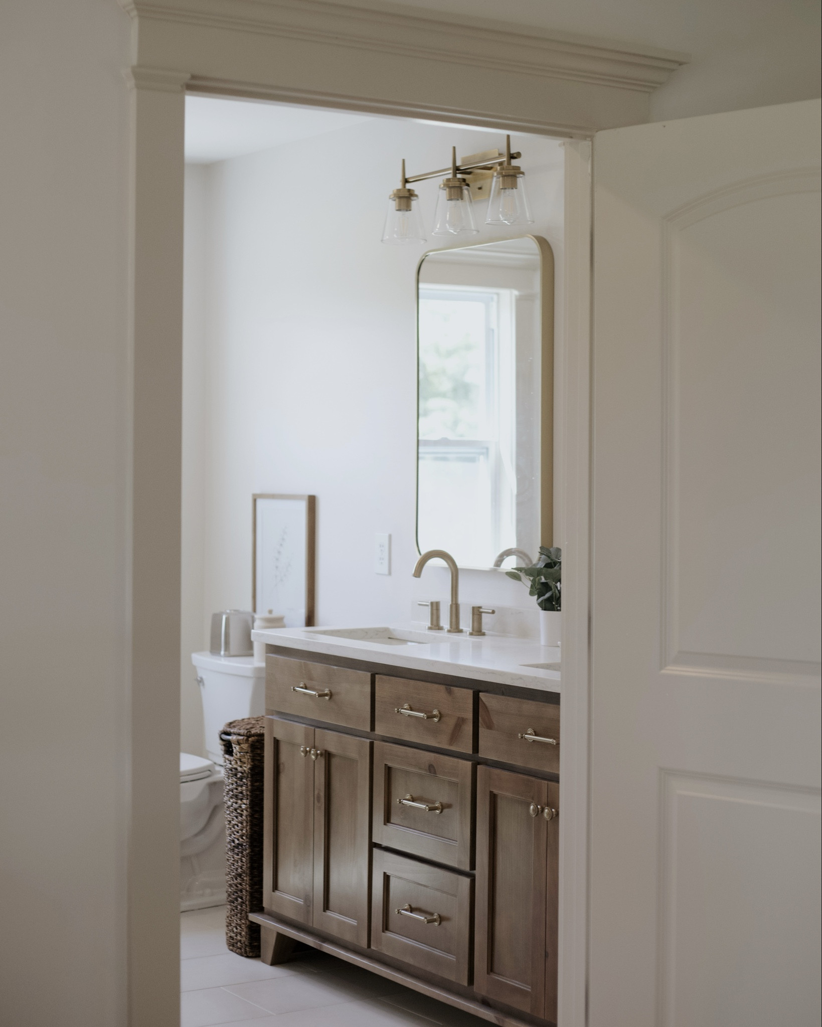 we have been loving the bright + airy feel to our primary bathroom. The oakwood vanity with satin brass accents tie it all together! 

#LTKHome