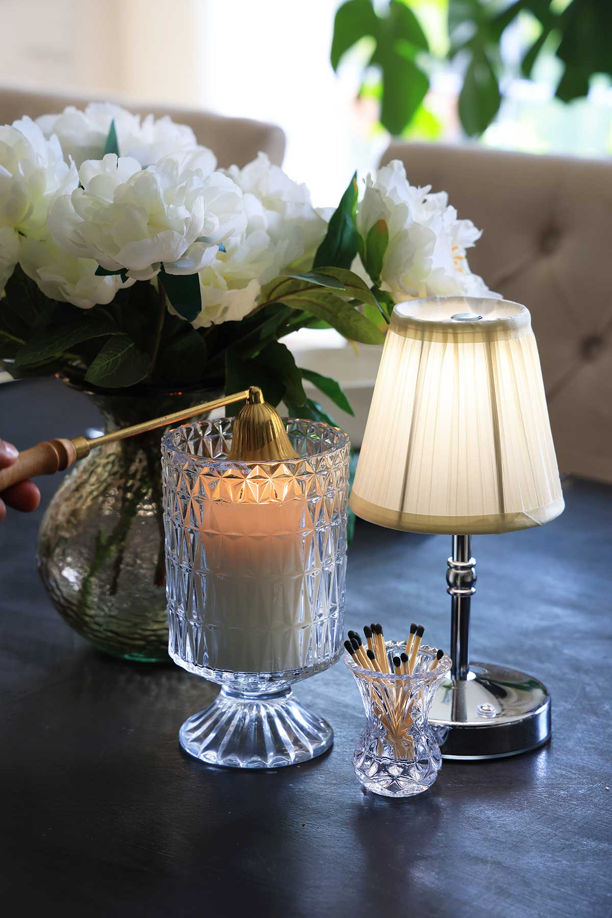 The perfect little vignette of ambiance items: Add a small cordless lamp, plus an embossed glass candle holder, cute matchsticks in a beautiful match holder, and candle snuffer. 

 #LTKHome