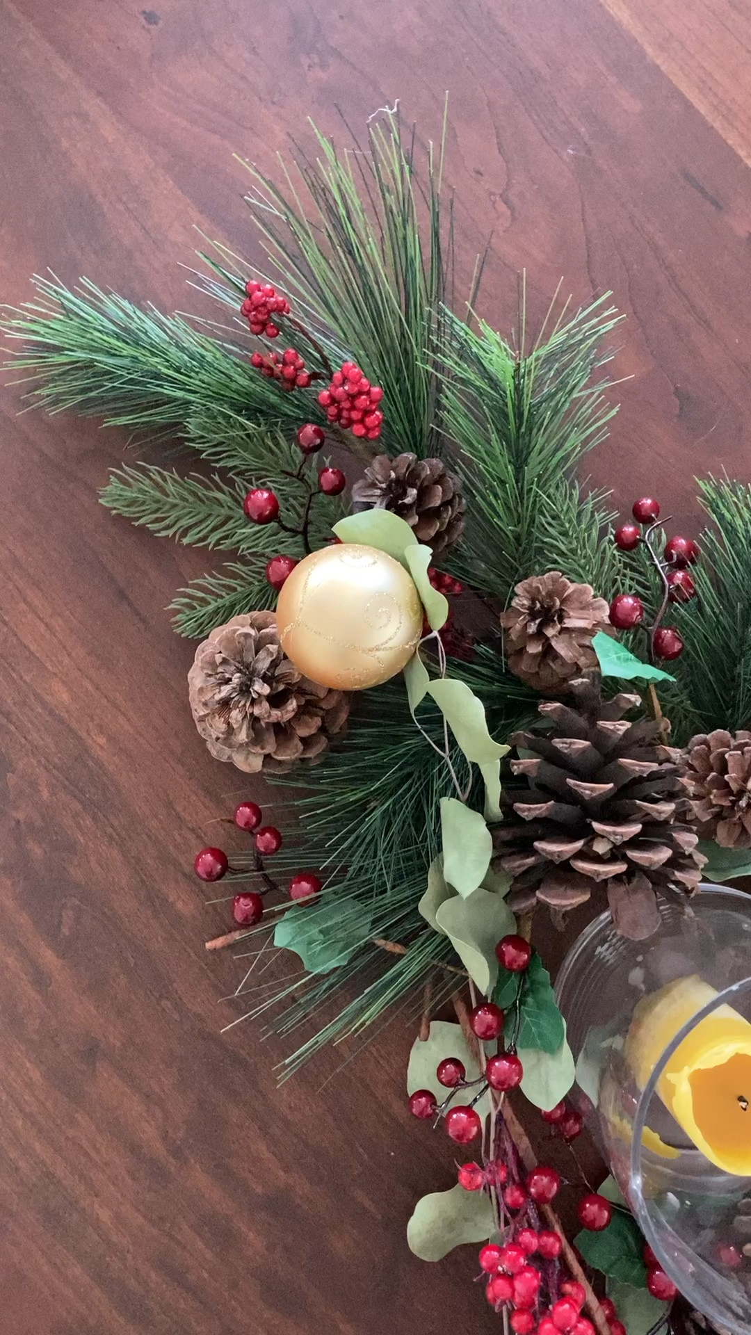 Holiday table, Christmas centerpiece, candles, red berries, evergreen picks, shatterproof ornaments, pine cone 

#LTKhome #LTKHoliday #LTKSeasonal