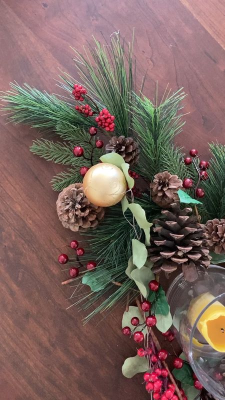 Holiday table, Christmas centerpiece, candles, red berries, evergreen picks, shatterproof ornaments, pine cone 

#LTKhome #LTKHoliday #LTKSeasonal