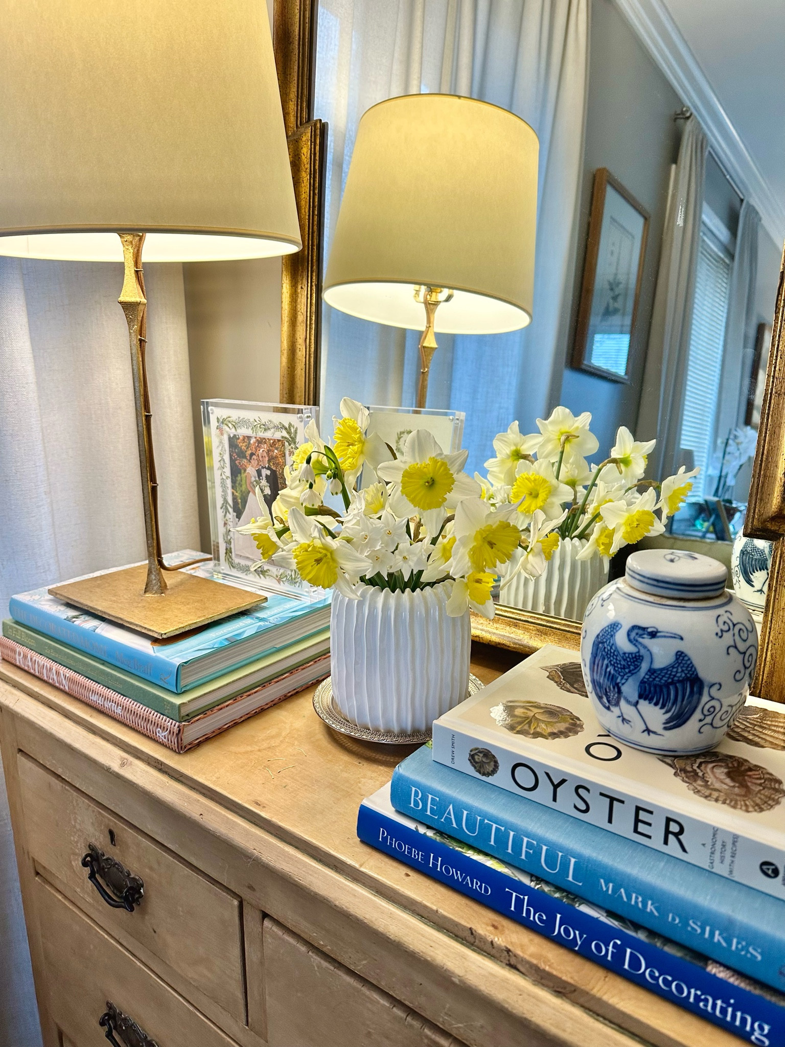Freshly picked daffodils situated in this cute white wave/ripple vase are brightening up this corner of our house! I’ve linked everything shown here for y’all!

Coffee table books, decorative books, blue book, Ming jar, blue and white vase, ripple vase, living room, flower arrangement, gold serena and lily visual comfort lamp, rattan 

#LTKfindsunder100 #LTKhome #LTKfindsunder50