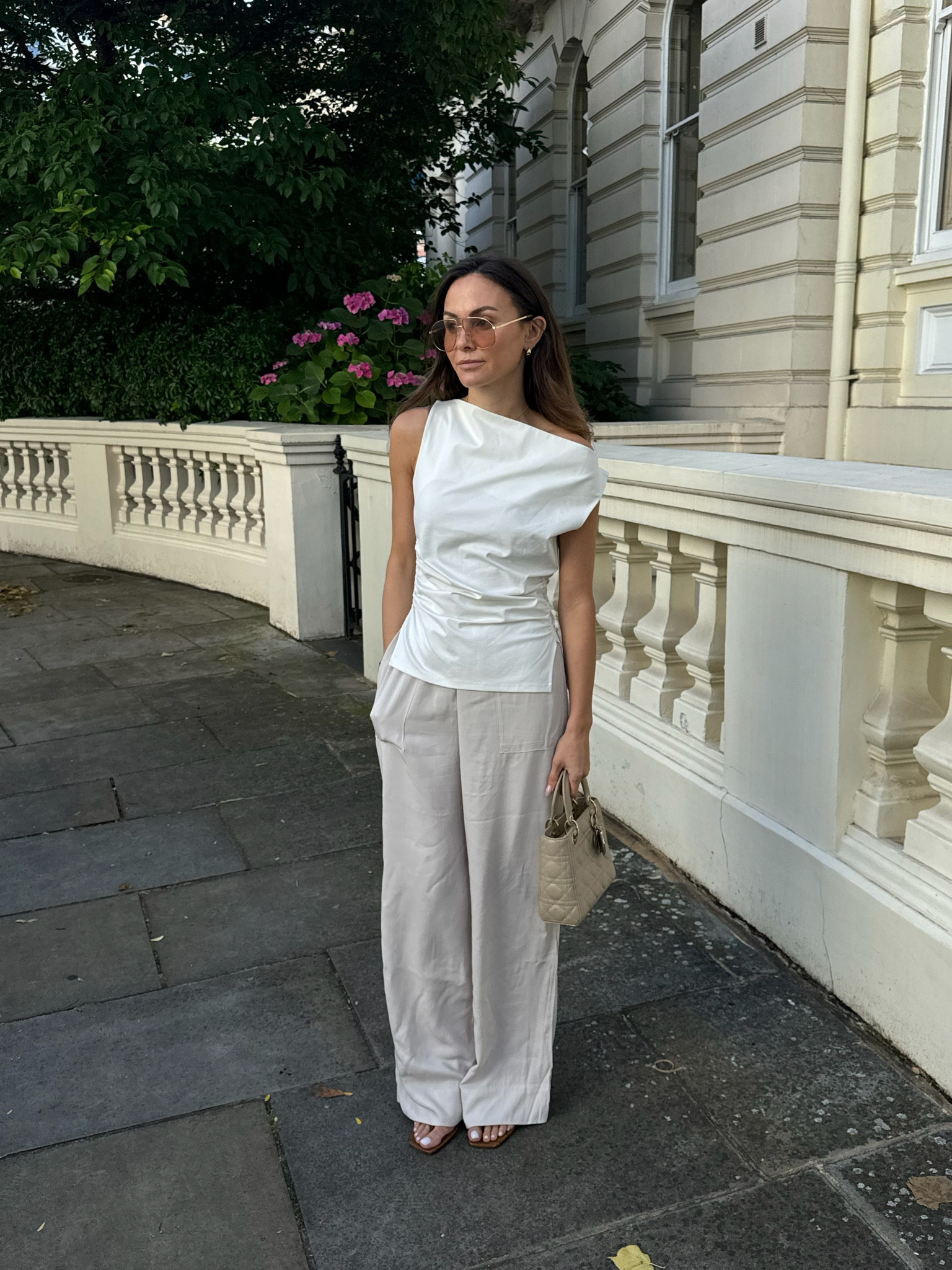 Cos, H&m, Toteme, Dior, Le specs, summer outfit, white top, asymmetric top, wide leg trousers, flowy trousers, kitten heels, Lady dior bag. summer outfits, neutral outfits 

#LTKstyletip #LTKeurope #LTKsummer