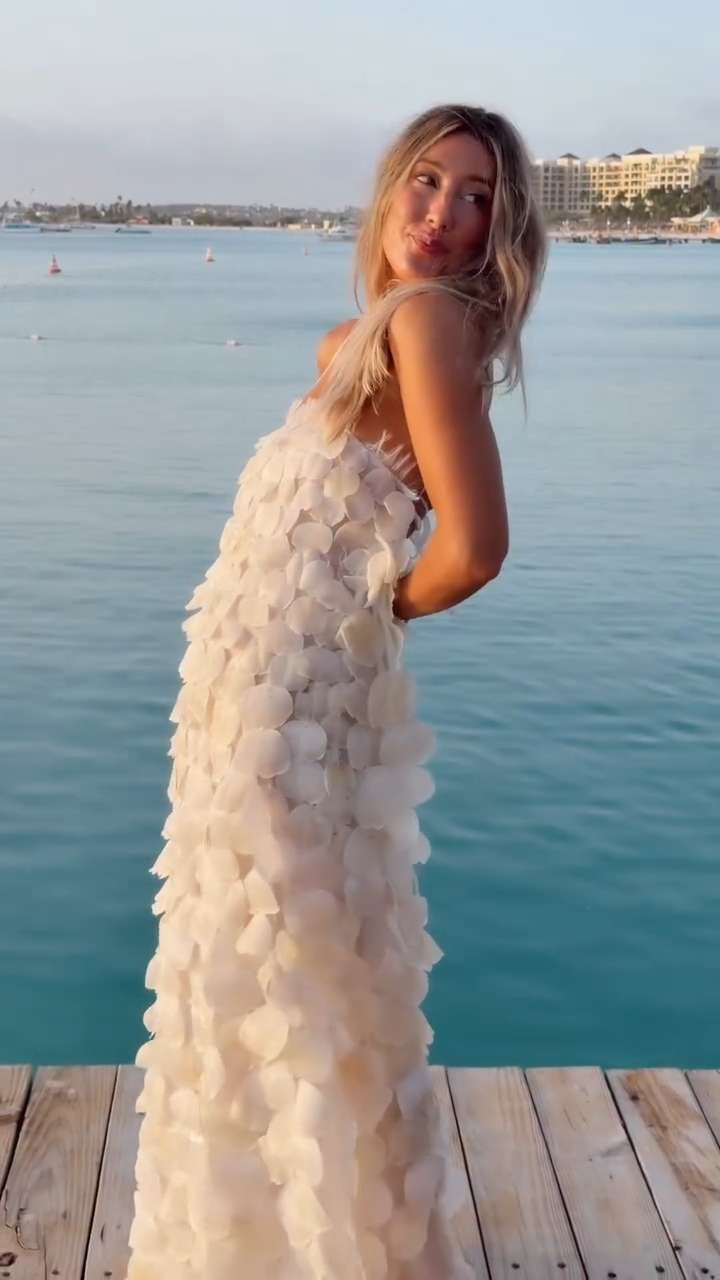 First outfit of the wedding weekend! This dress deserved a moment!!! It felt like wearable art and was the perfect statement piece to kick off the weekend 🐚🐟

We hosted our welcome dinner on the pier and it was honestly surreal having everyone there…kind of insane in the best way! We spent the day at the beach as everyone slowly started to arrive. We were so excited, couldn’t believe the weekend was finally here and quite possibly a touch more excited to wear this dress 😂 Everyone’s energy was contagious, it was sooo cool!!! Sharing more in stories! x

Cover photo: @sberardweddings & content by: @capturedmems_

Planning & Design: @alongsideannie
Photography: @sberardweddings
Content: @capturedmems_
Cinematography: @amandafilms__
Welcome Party: @pelicanpieraruba
Stationery: @glowpapercompany
Florals: @naunet_studio
Event Rentals, Lighting, AV: @perfectteameventplanners | @swingmasterz
Linens: @bbjlatavola
Custom welcome bags: @stjamesembroidery 

 #LTKWedding