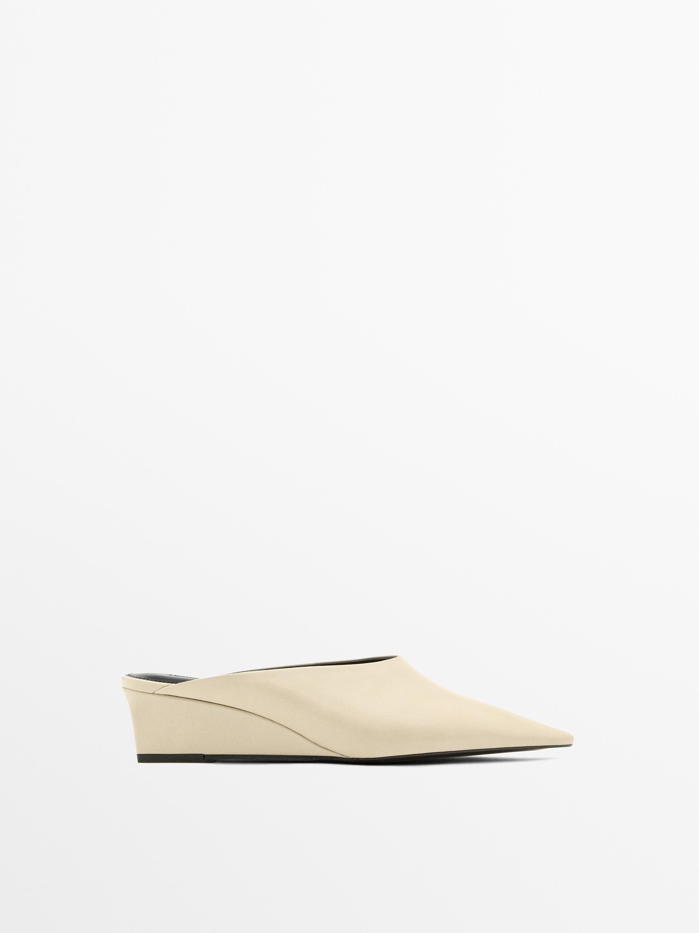 VIEW LOOK
Wedge heel mules

 £129  Colour:  Beige  Add to basket | Massimo Dutti UK