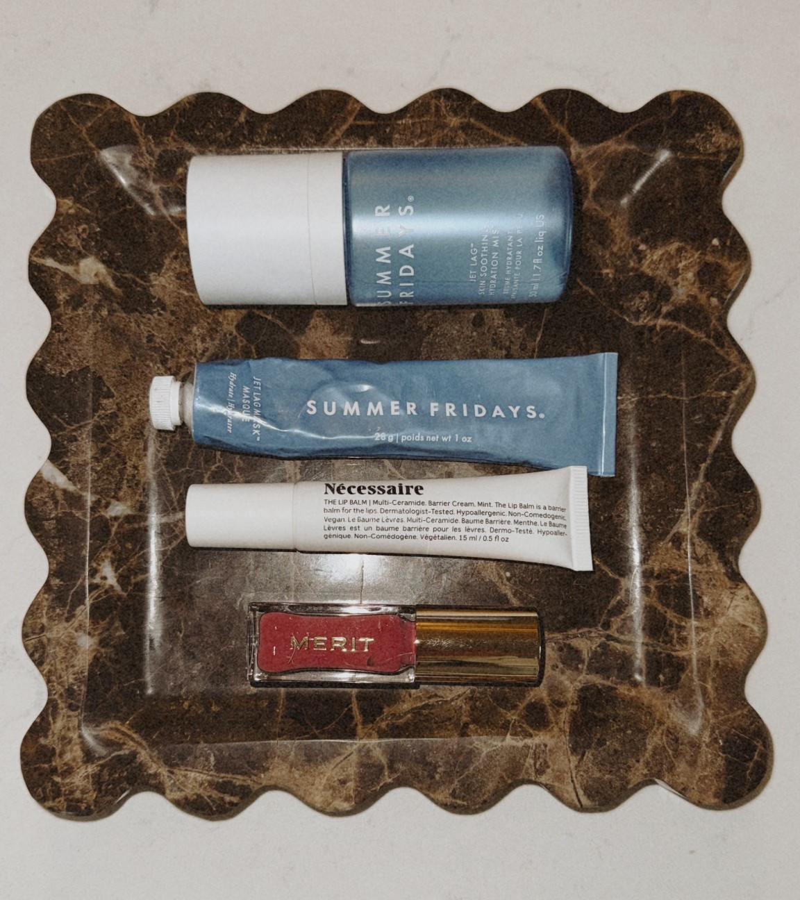 What’s in my bag 👜🫣💄 LOL typical! A few lip balms & skincare! Summer Fridays Jet Lag items are a must, especially when traveling. ✈️  #purseitems #meritbeauty #merit #summerfridays #jetlag #necessaire #marbletray 

#LTKBeauty #LTKTravel #LTKselfcare