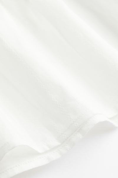 Blusa con ribete de encaje | H&M (FR, IT, ES, PT, BE)