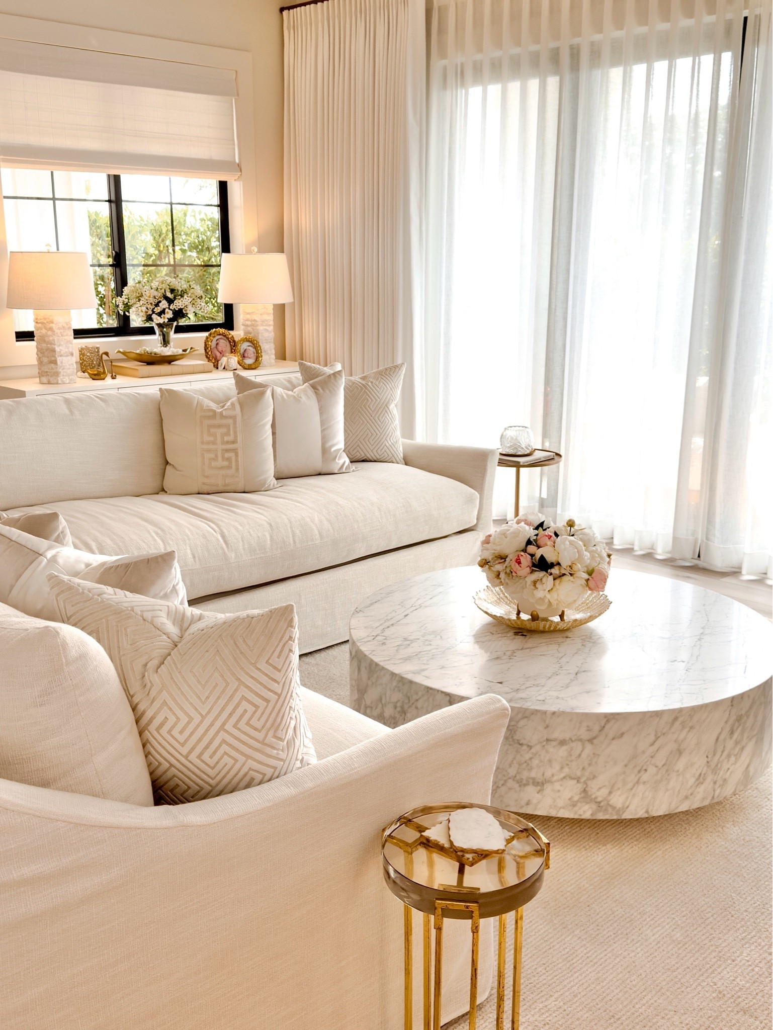 Living Room details 🤍

Sectional fabric is Canvas performance fabric. ￼

Drapes & shades from thewindowstylist.com. Tania is amazing if you live in SoCal or Nashville.

Coffee table is the 48” round marble plinth from Restoration Hardware ￼