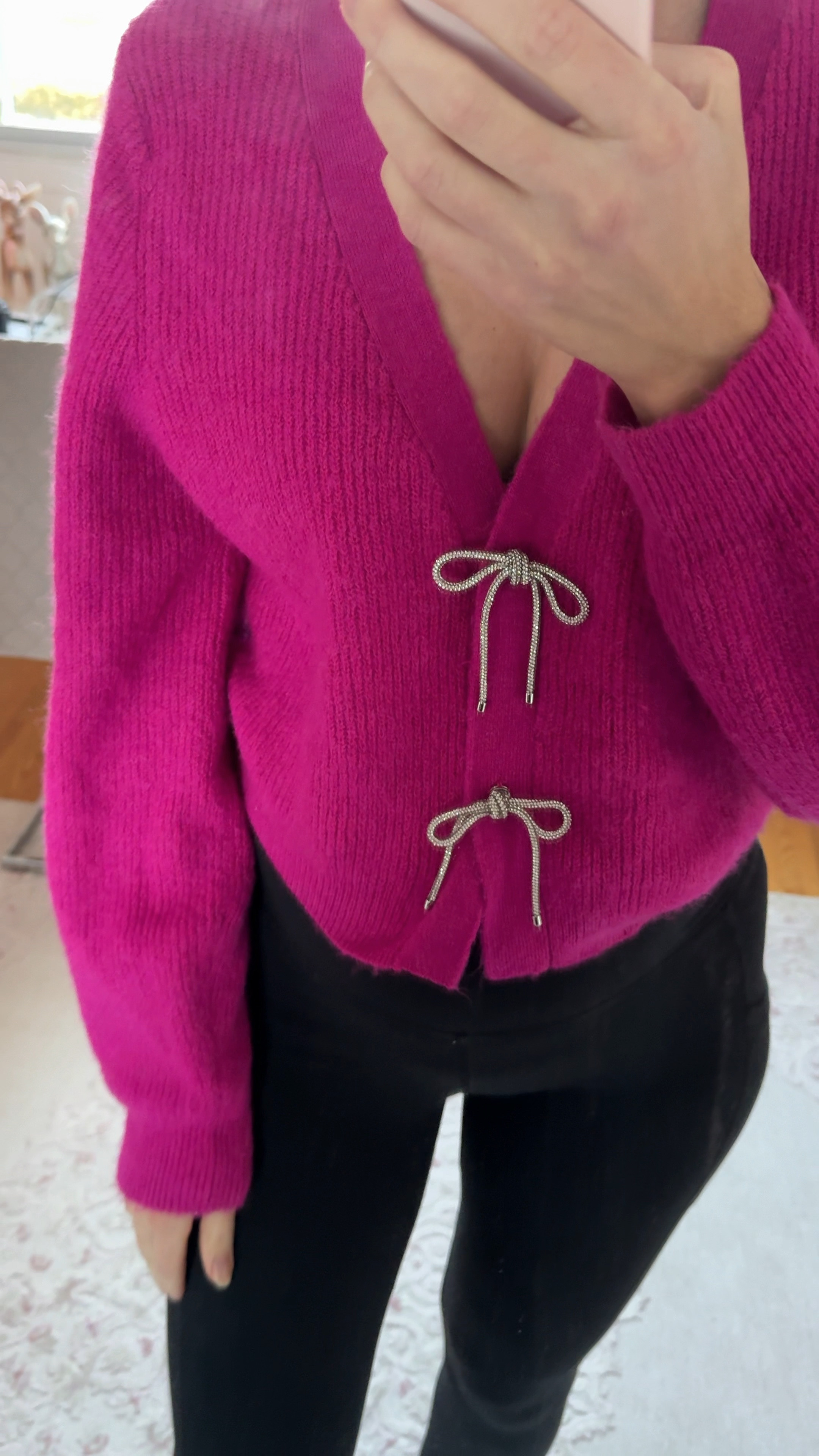 Oversized bow cardigan wearing last years version of it.
Linked the new one below 


#LTKFindsUnder50 #LTKHoliday #LTKStyleTip