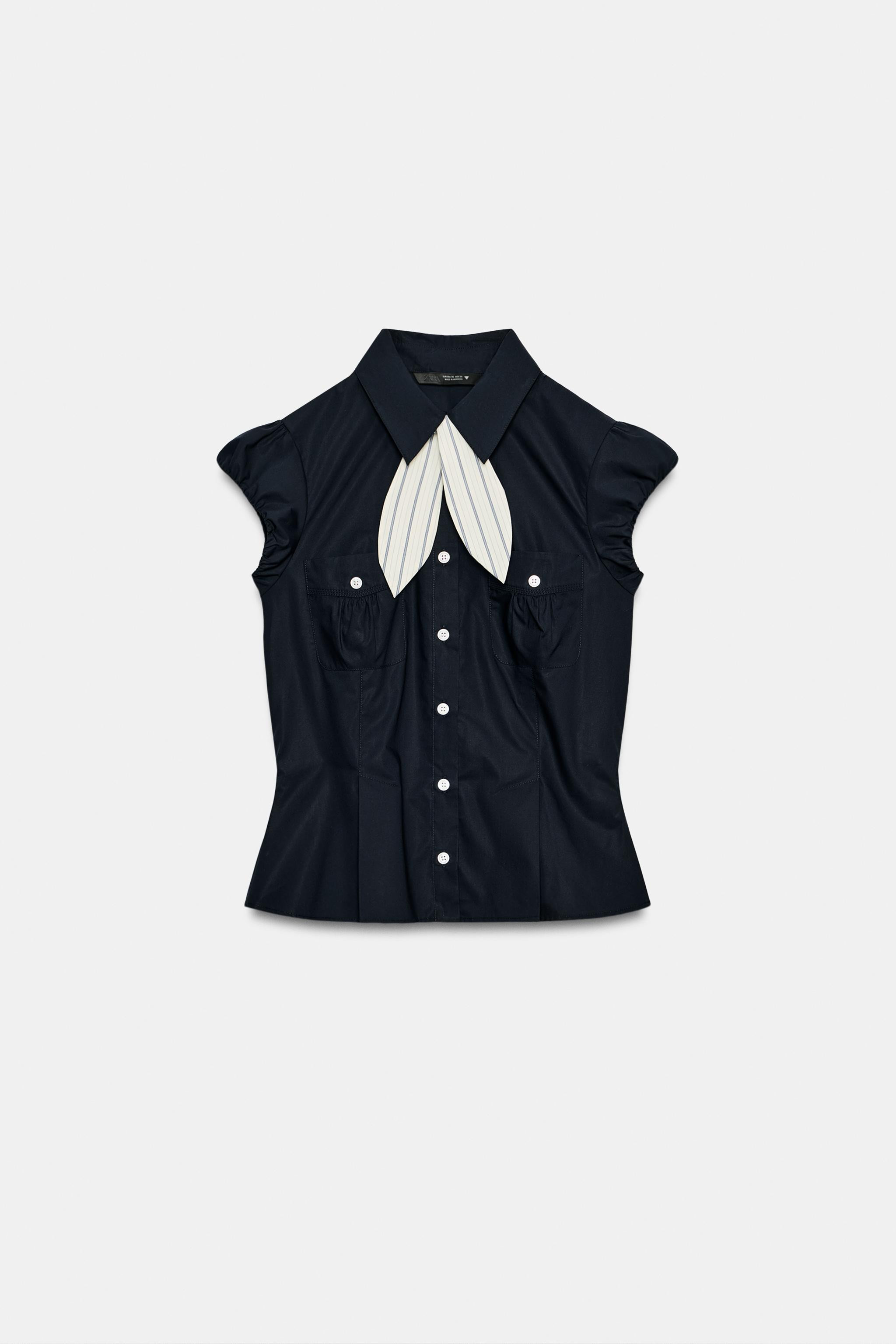 Tailored shirt with a regular collar and short puffed sleeves finished with elasticated cuffs. Fe... | Zara DE