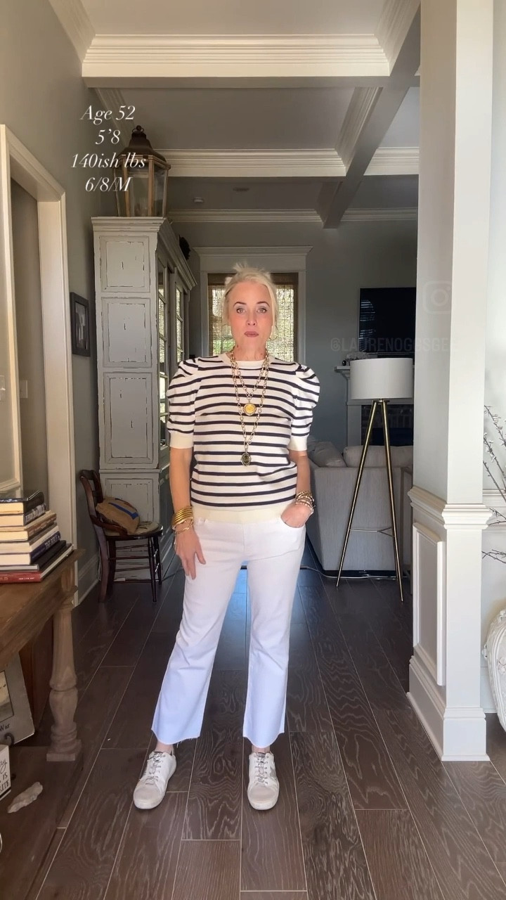 To me, Avara is synonymous with classic, well-made closet staples. And this Mandy Top in Navy pairs perfectly with these crisp white Kelsey High-Rise Ankle Flare with Raw Hem denim jeans from Kut to define the term classic comfort. I adore the buttery soft fabric and puff sleeve detailing of the striped sweater. I’m wearing my true size medium. And Kut is a brand of premium denim known for its flattering fit and high-quality fabrication. These jeans have great stretch, are fitted through the hips and thighs, and are polished off with a cropped kick flare. The great thing about the raw hem is that it allows you to cut them to your perfect length without paying for alteration. I’m in a 6. If you are in between sizes,  I’d say to go down one. I polished off the look with my favorite gold and pewter jewelry from Jennifer Ponson Designs and Amazon and woven slides from Mia. 

#LTKSeasonal #LTKover40 #LTKstyletip